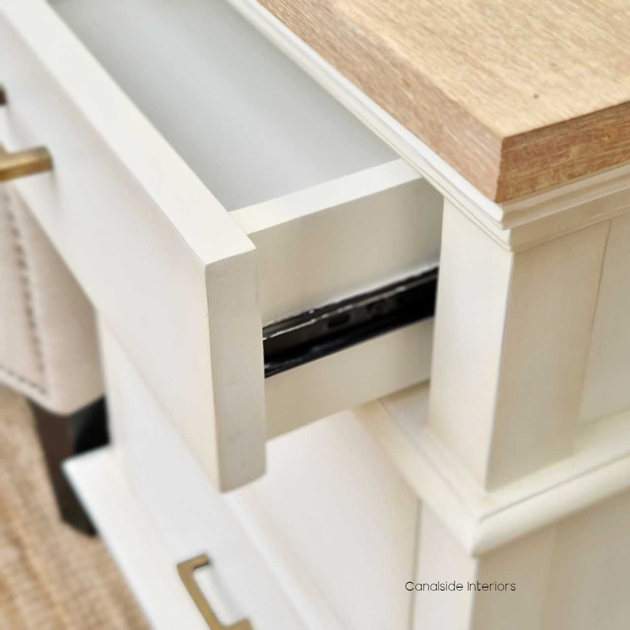 Detail shot of the smooth metal runners, showcasing the practicality and quality craftsmanship of the drawers.