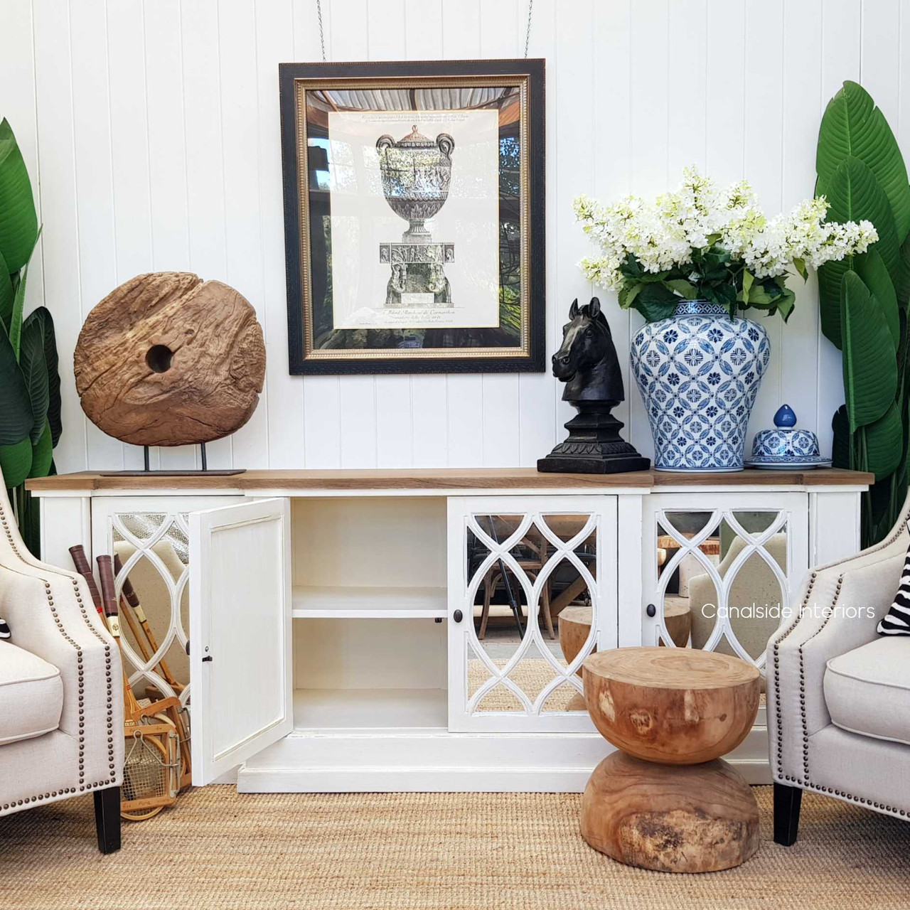 View of the Marielle Sideboard, emphasizing its stepped front design and the depth of its weathered oak top.