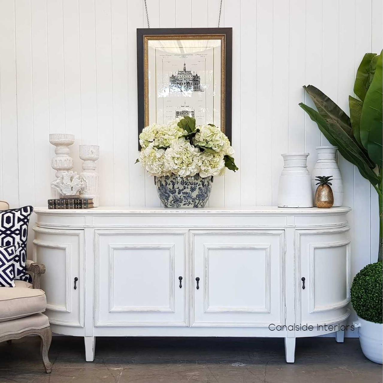 For the home office, Canalside Interiors' Francia Sideboard in distressed off white provides both elegance and practicality, with ample space for storage and display.