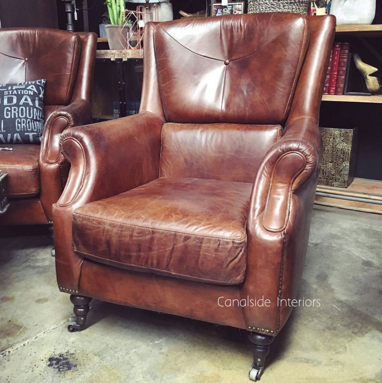 Sink into the aged leather of the Eton Chair, a must-have for a plush lounge room experience - Canalside Interiors