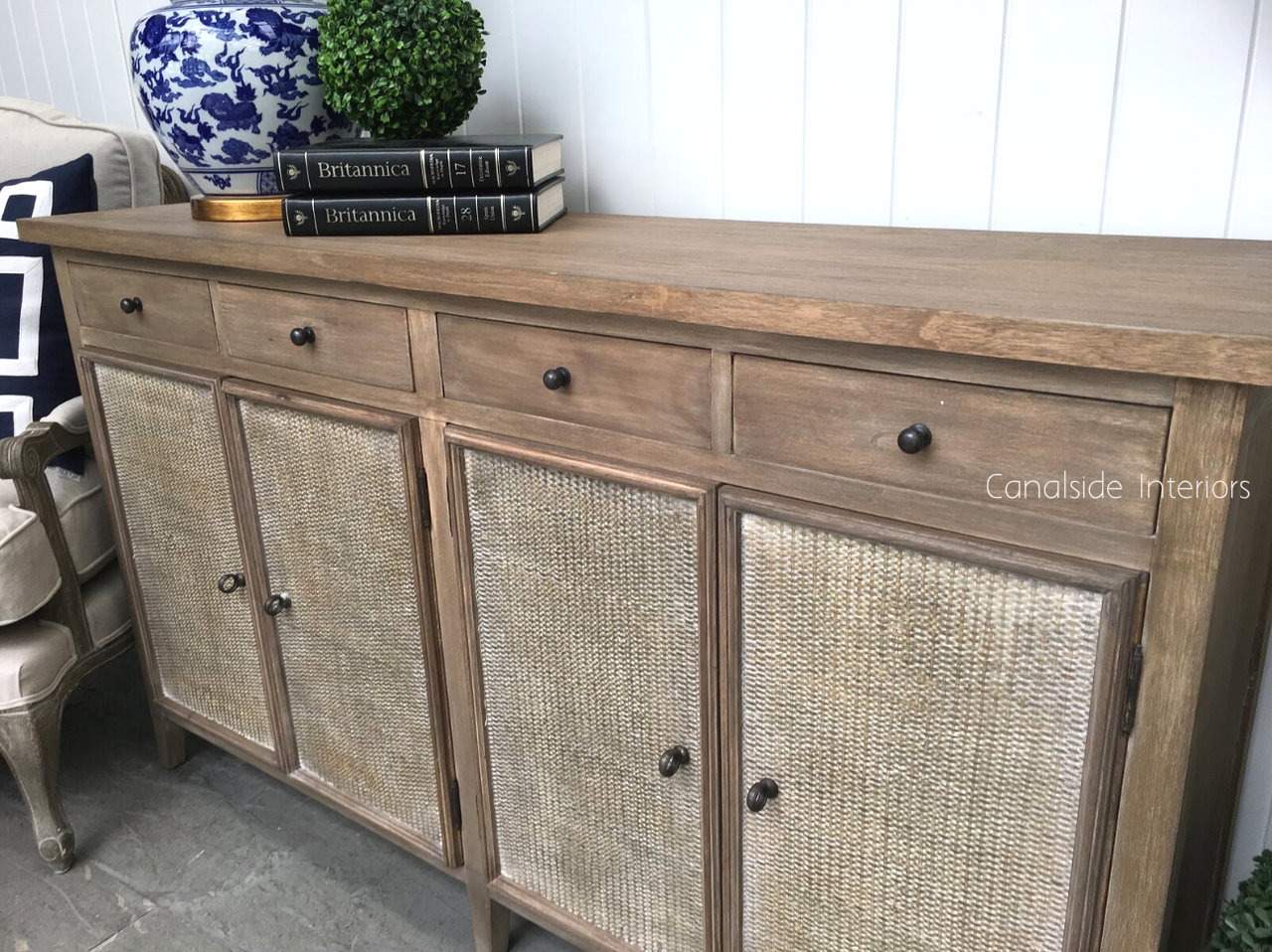 Angled shot showing the sideboard’s generous storage capacity, with drawers partially opened to reveal the spacious interior.