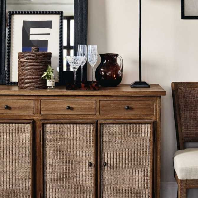 Lifestyle image of the sideboard in a casual lounge setting, paired with soft, natural textiles to accentuate its relaxed island feel.