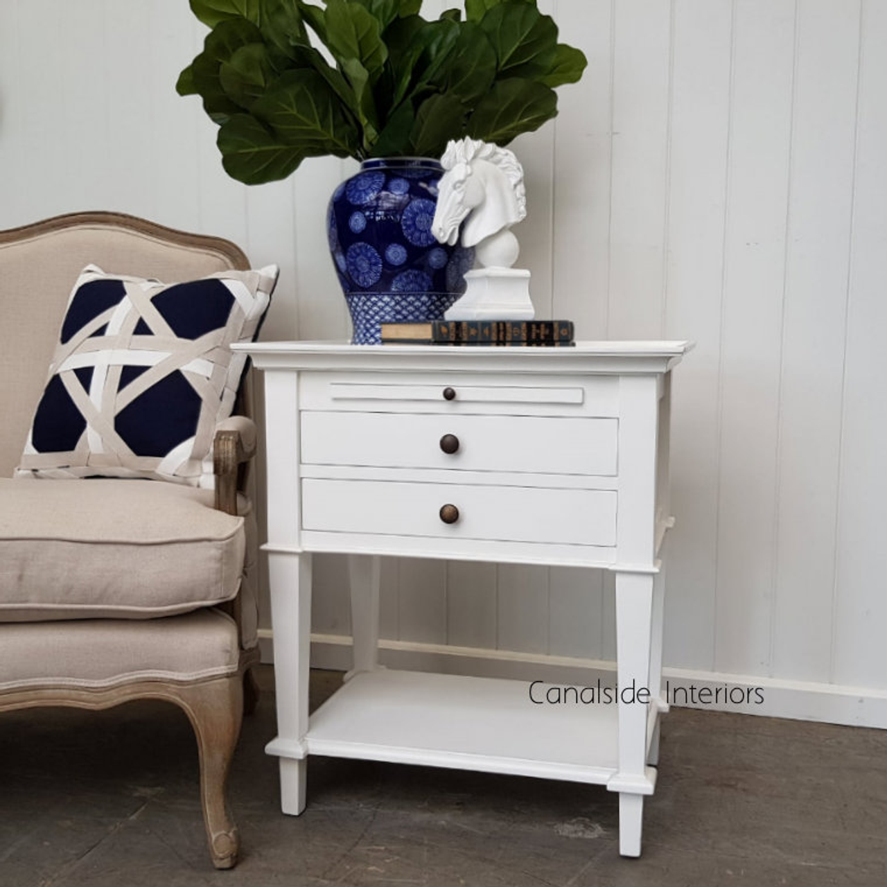 Classical design gets a modern twist in this white Butler Side Table from Canalside Interiors, perfect for any living room or lounge setting