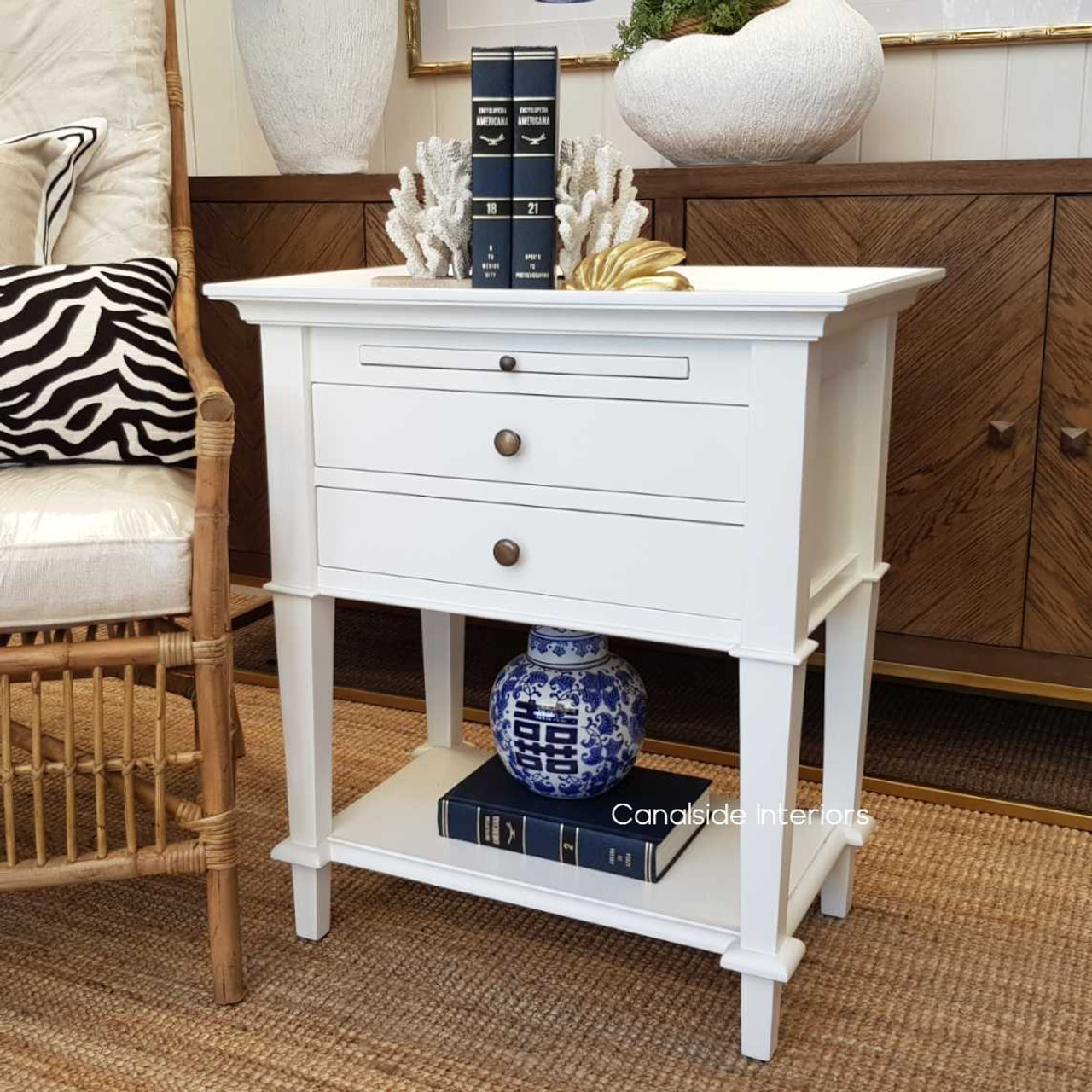 Angled view featuring the practical pull-out tray, ideal for expanding usable space in any bedroom or lounge setting.