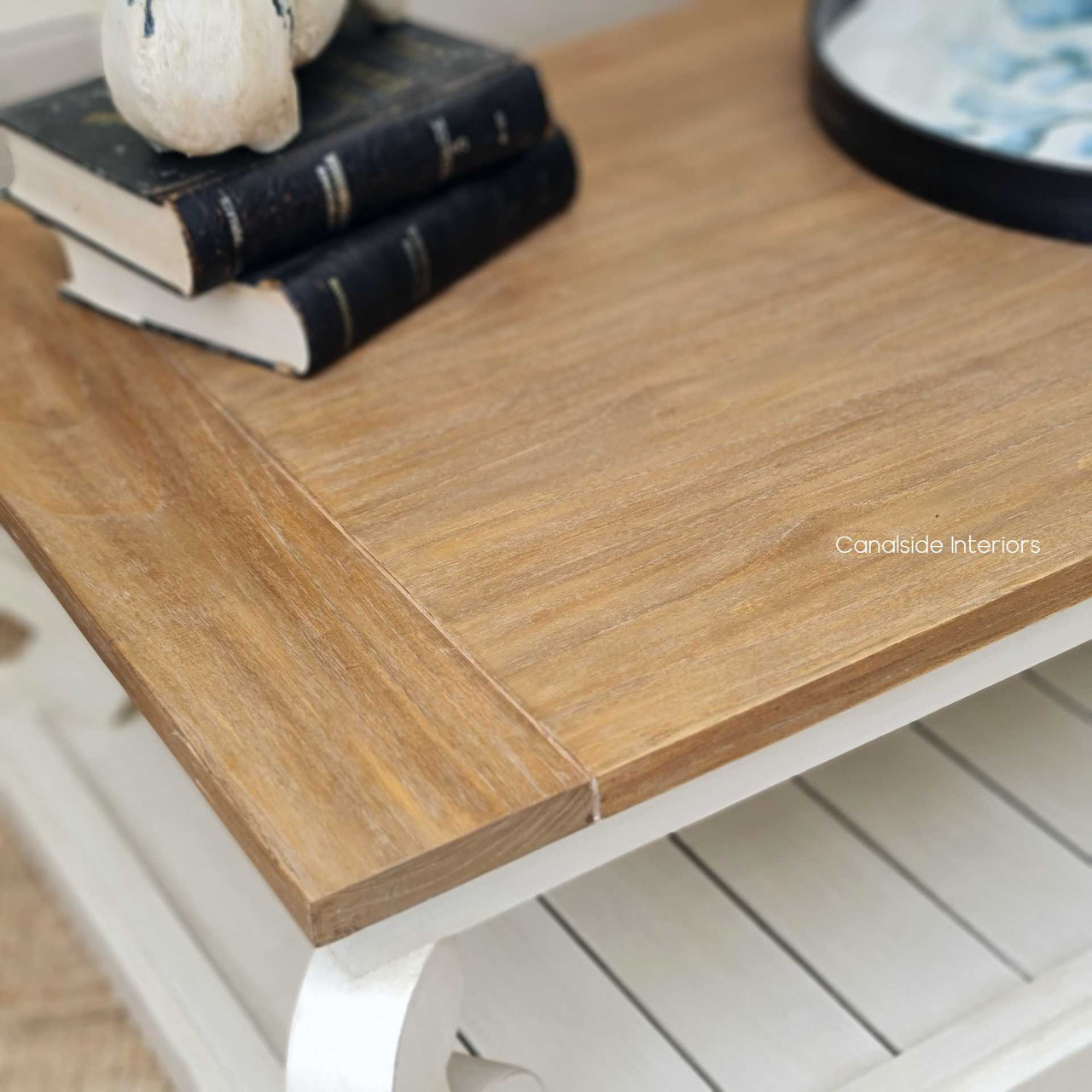 Close-up of the coffee table's weathered finish, reflecting the attention to detail and quality materials used in its construction.