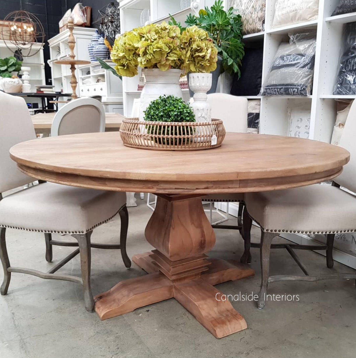 The dining table adorned with sophisticated dinnerware, ready to elevate any dining experience with its rustic yet refined charm
