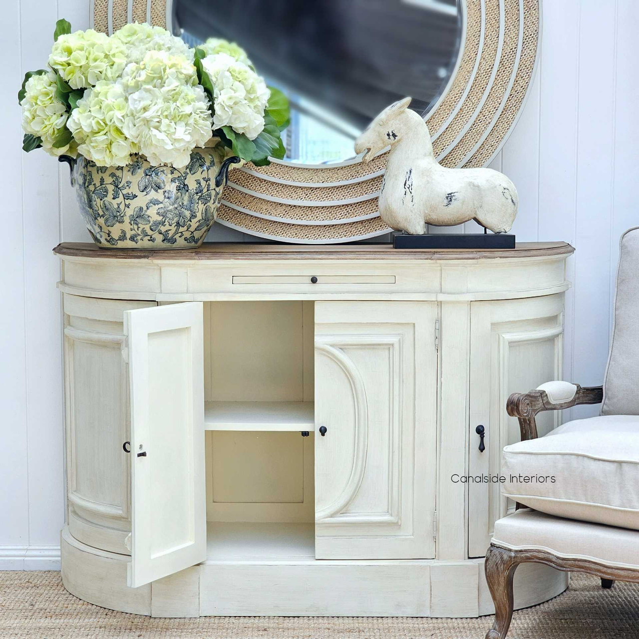 With its curved edges and classic design, the Bastian Sideboard complements the contemporary yet timeless aesthetic of a stylish lounge room