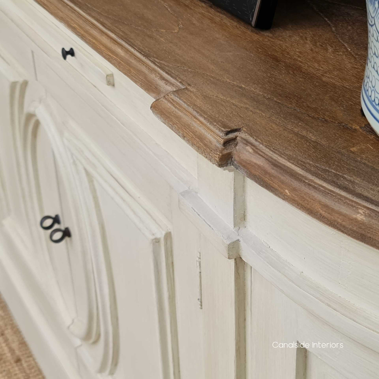 Designed with a weathered oak top, the Bastian Sideboard presents a durable and stylish surface for displaying decor, reflecting Canalside Interiors' dedication to quality furniture