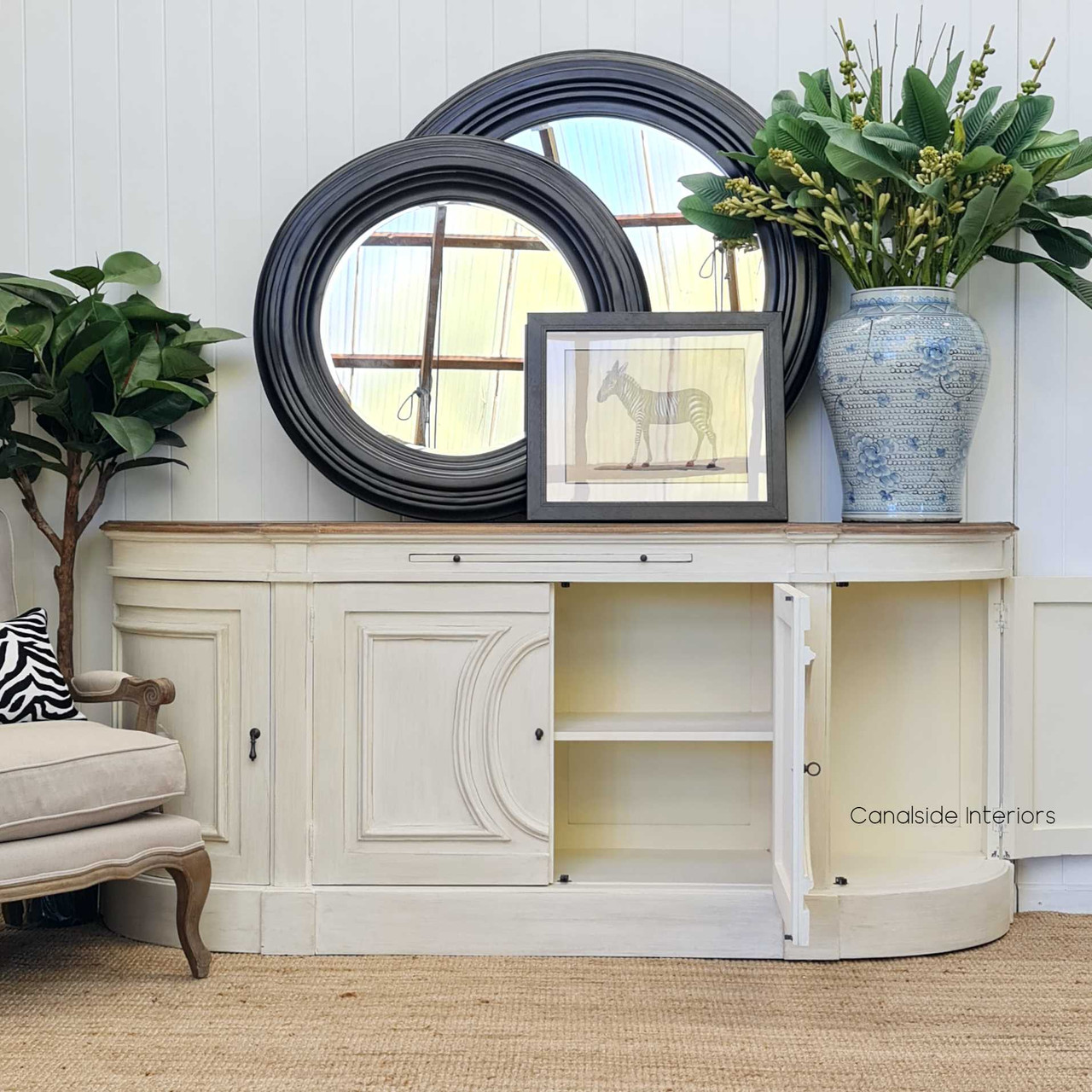 Placed within a living space, the Bastian Large Sideboard anchors the room with its traditional silhouette and substantial size, curated by Canalside Interiors for luxurious living.
