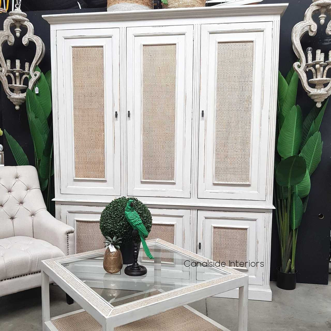 Interior shot showcasing the spacious storage compartments within the Brielle Rattan Cupboard, perfect for organizing essentials.