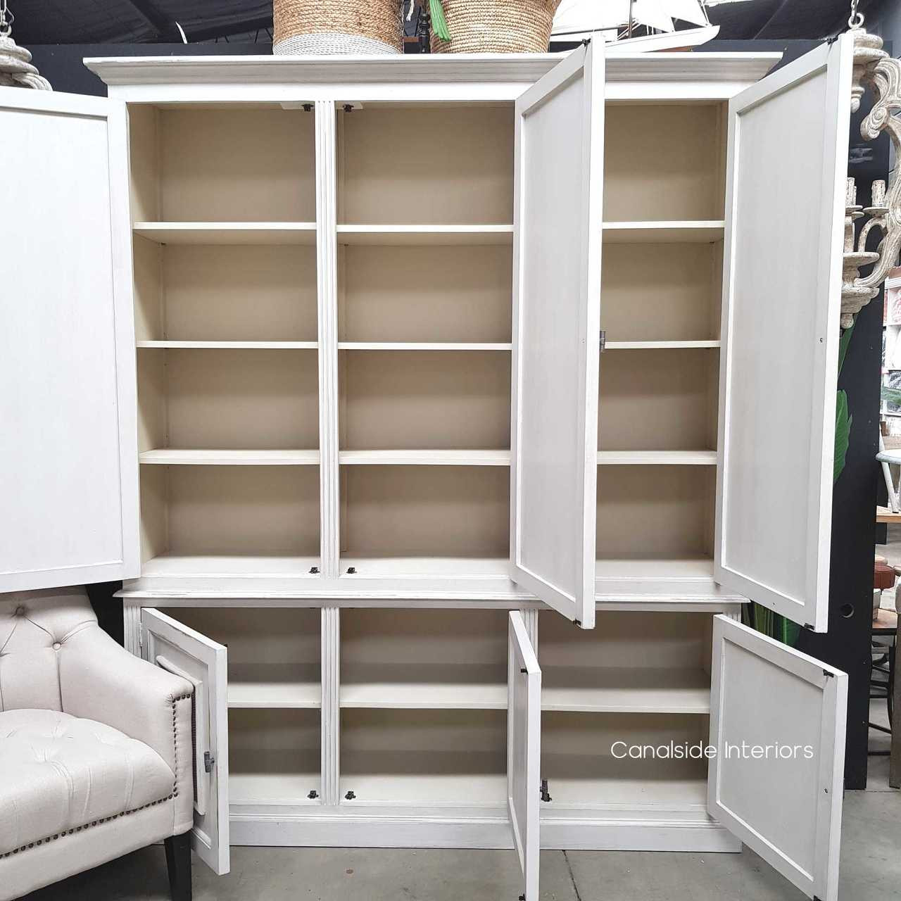 View with open doors, revealing the cupboard's internal shelving and practical storage solutions.