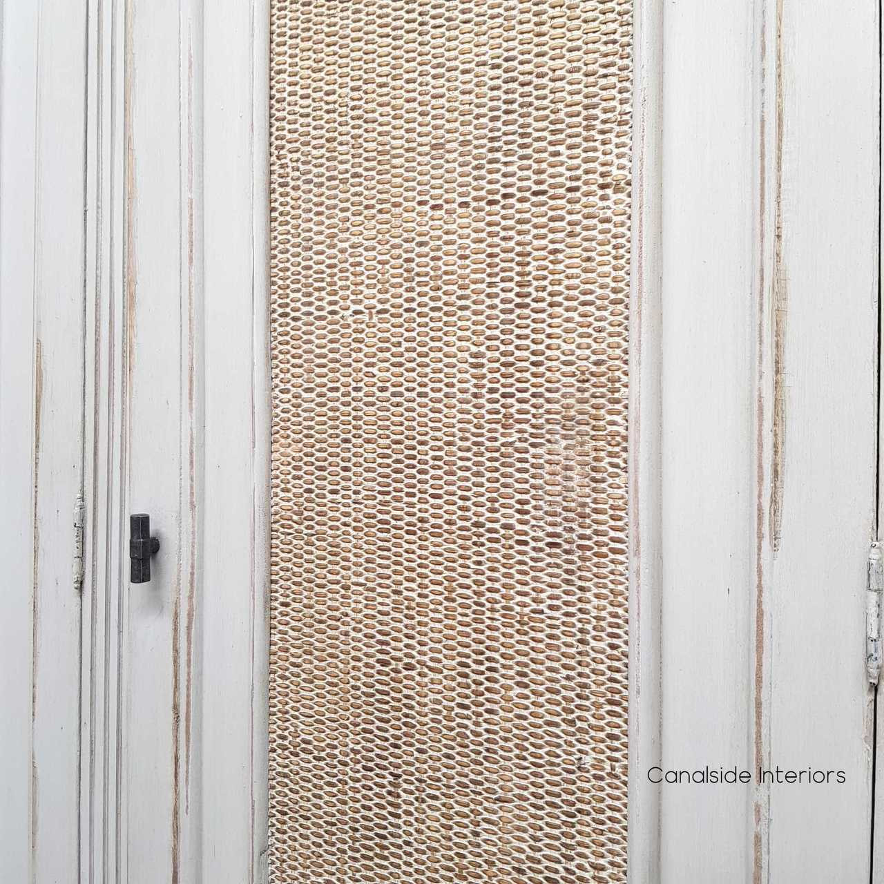 Detail view of the natural washed rattan, capturing the unique variations and artisanal beauty of the material.