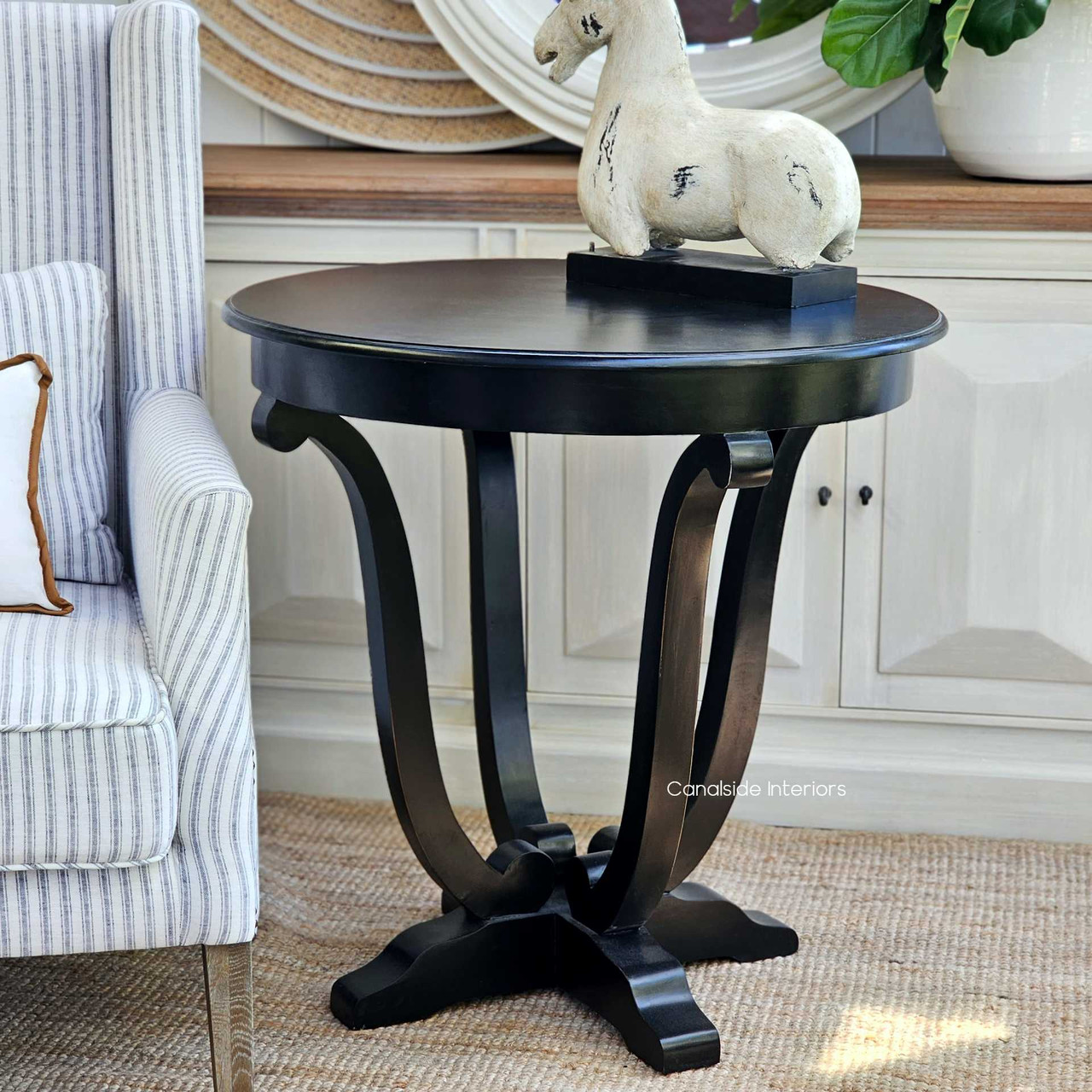 This Downton Round Table is a statement of elegance in any living room, offering a Hamptons vibe with a versatile, modern twist