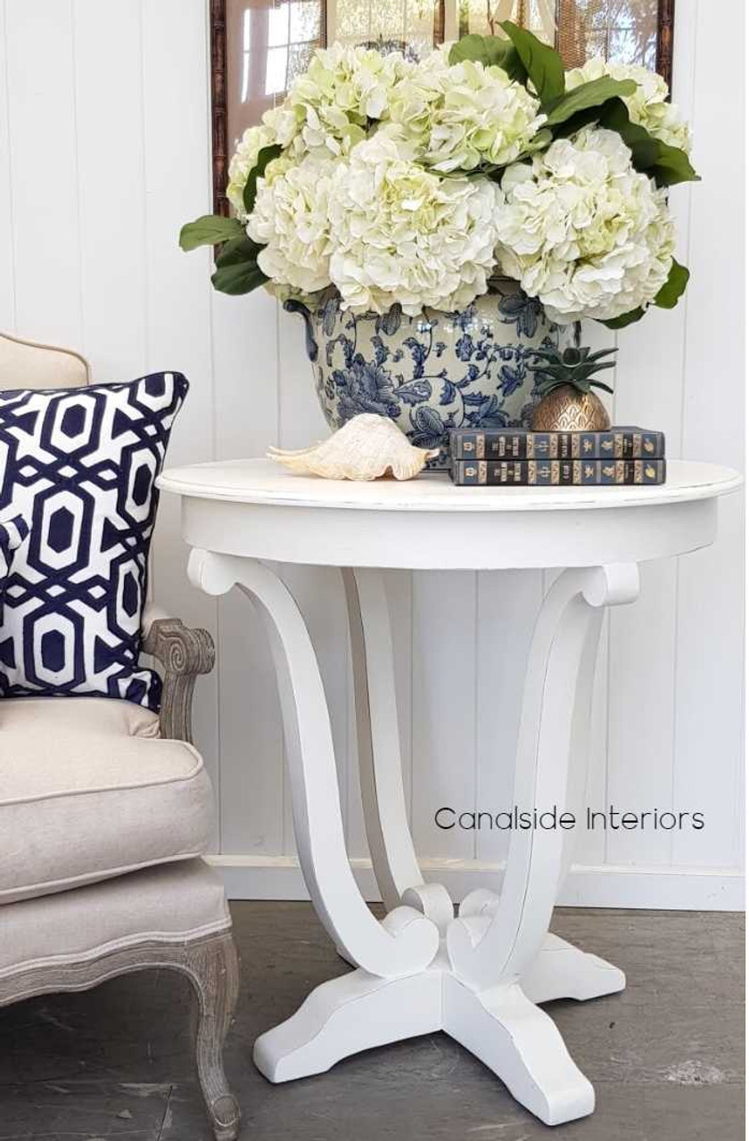 As a bedside companion or a living room feature, the Downton Round Side Table's versatility is matched only by its coastal elegance