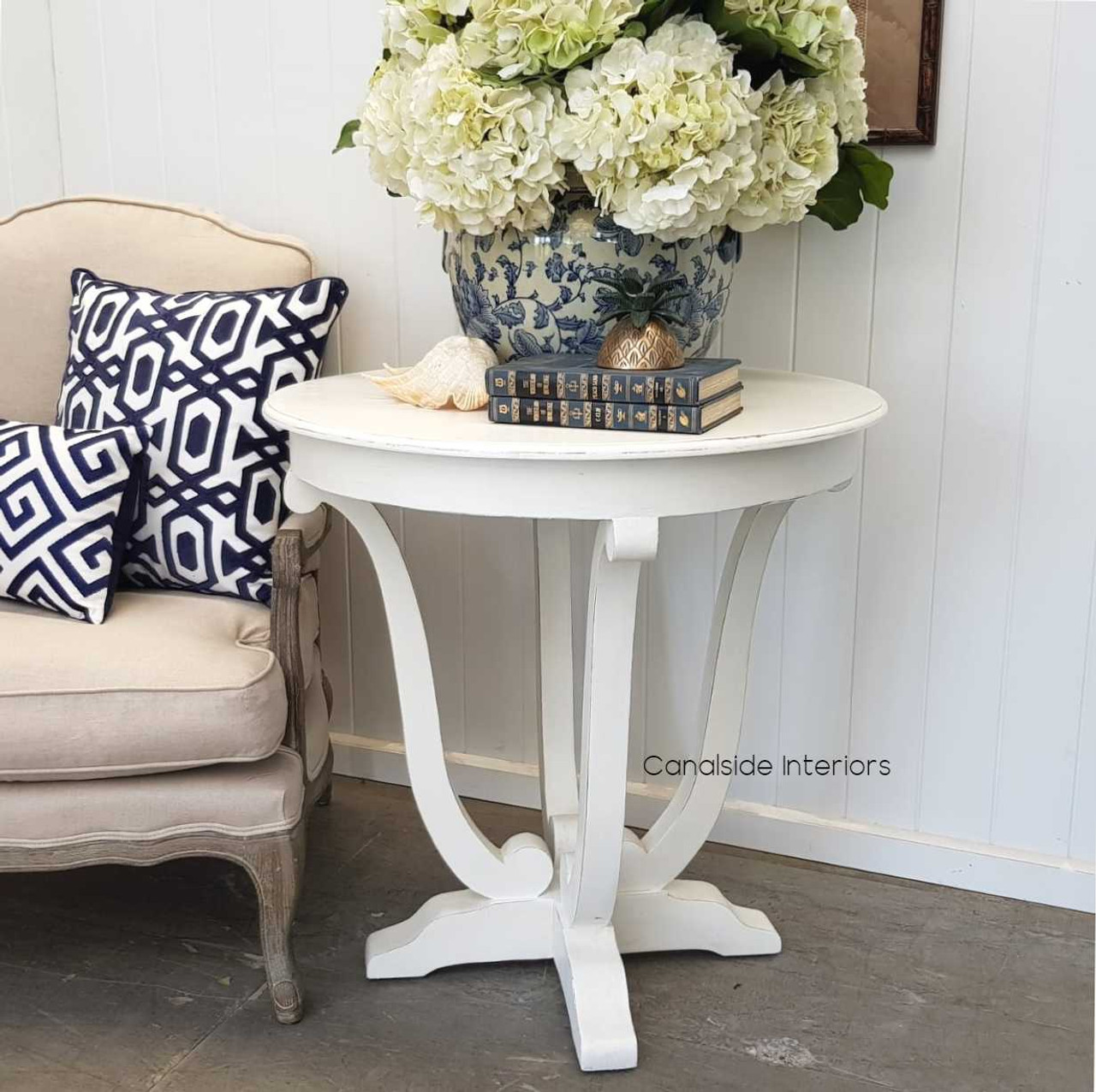 This Downton Side Table from Canalside Interiors brings classical charm to any lounge room, its round shape and distressed paint adding to its timeless quality