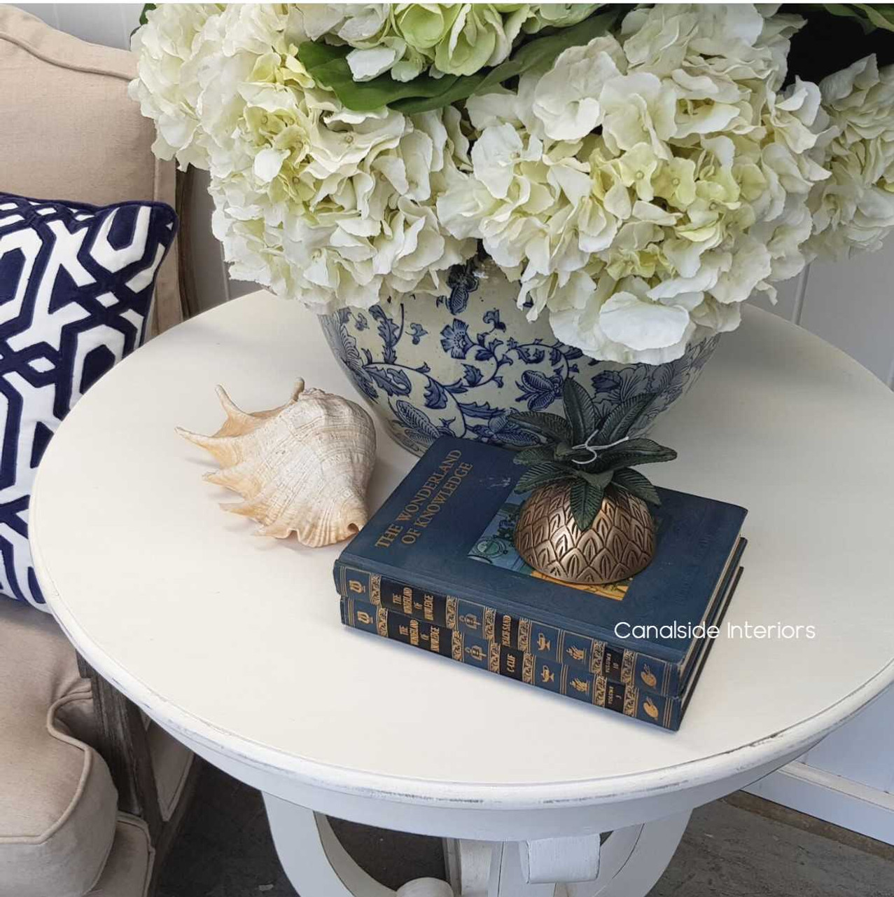 This Downton Side Table from Canalside Interiors brings classical charm to any lounge room, its round shape and distressed paint adding to its timeless quality