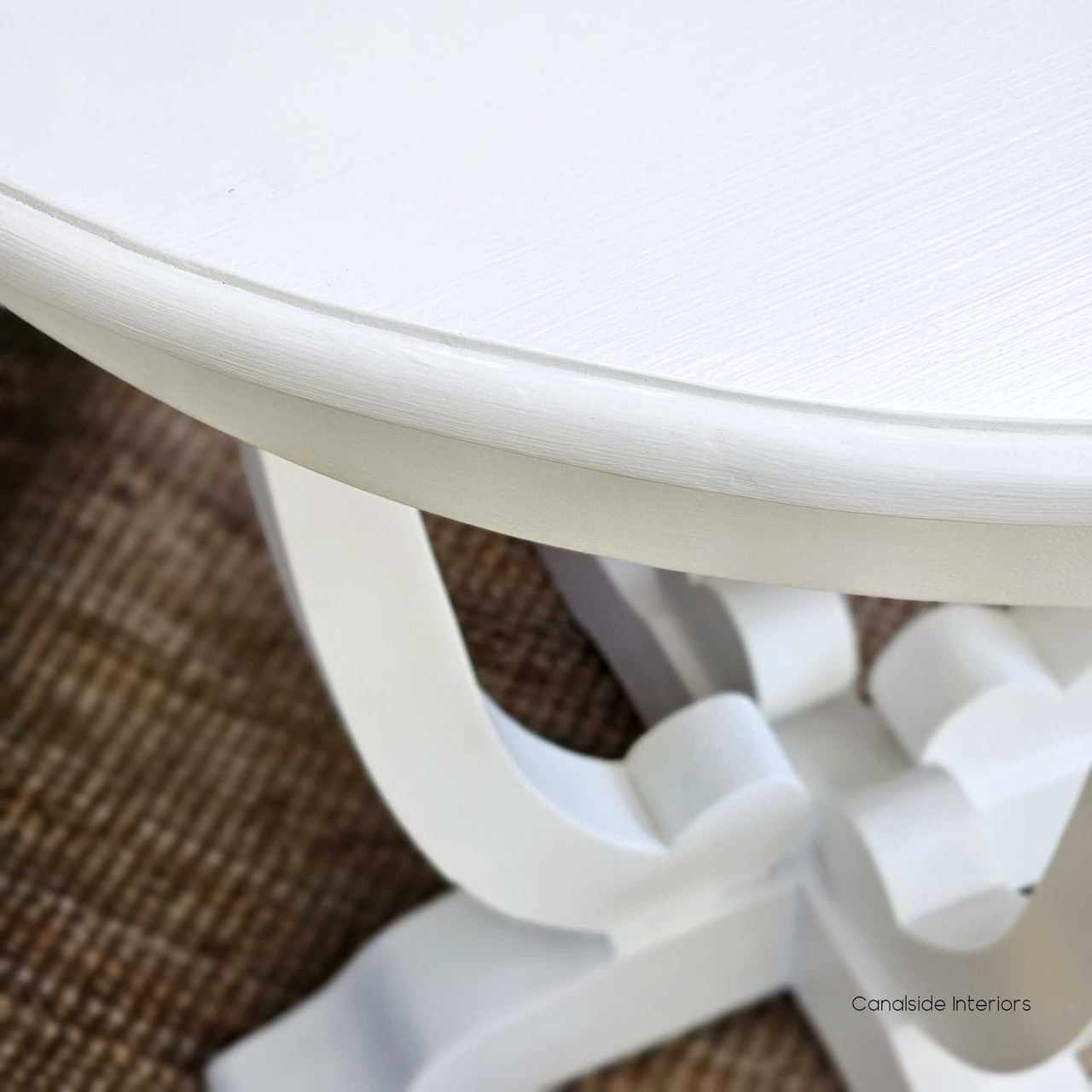 Accent your living space with the graceful curves of the Downton Round Side Table in distressed white, reflecting the coastal serenity of Hamptons style living