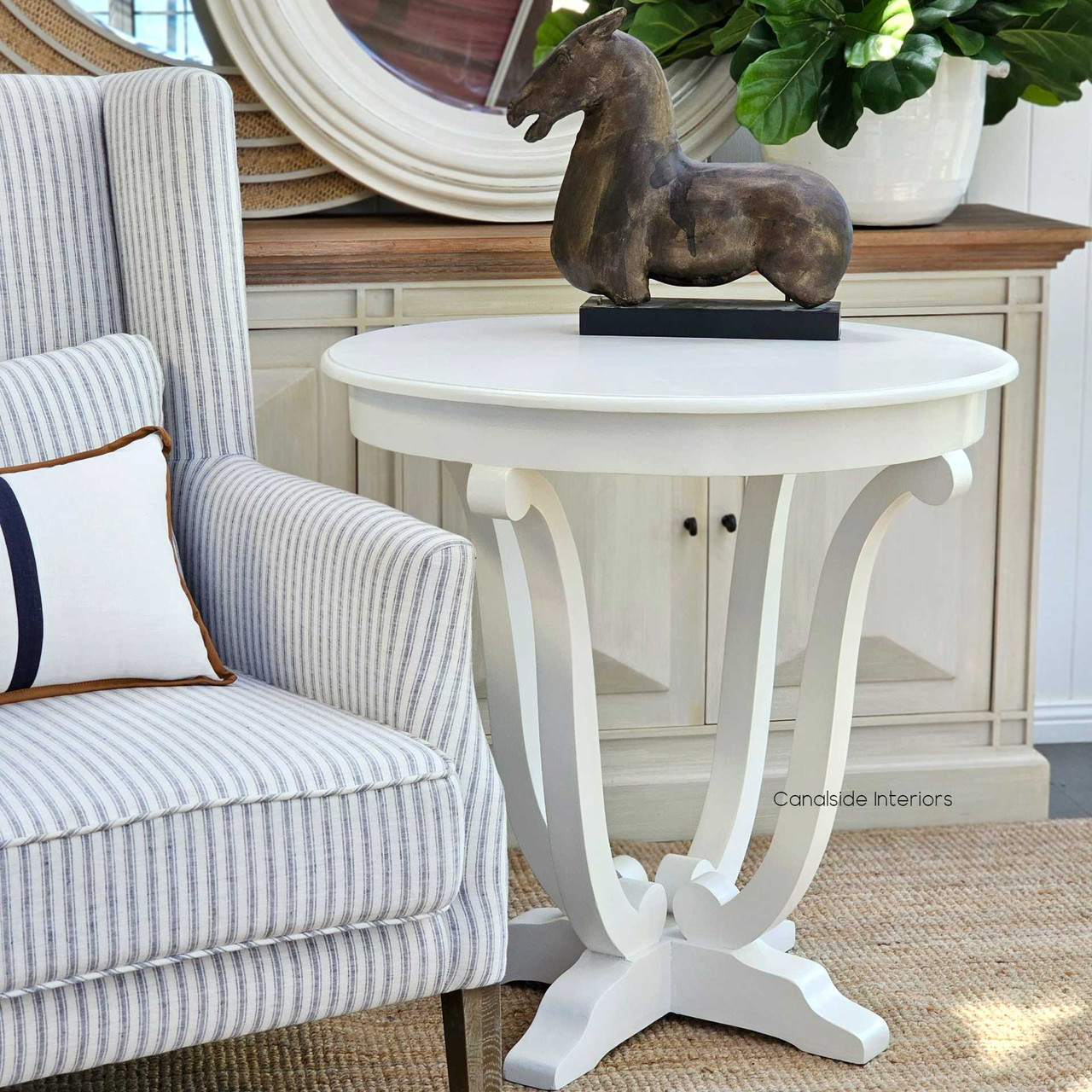 This Downton Side Table from Canalside Interiors brings classical charm to any lounge room, its round shape and distressed paint adding to its timeless quality