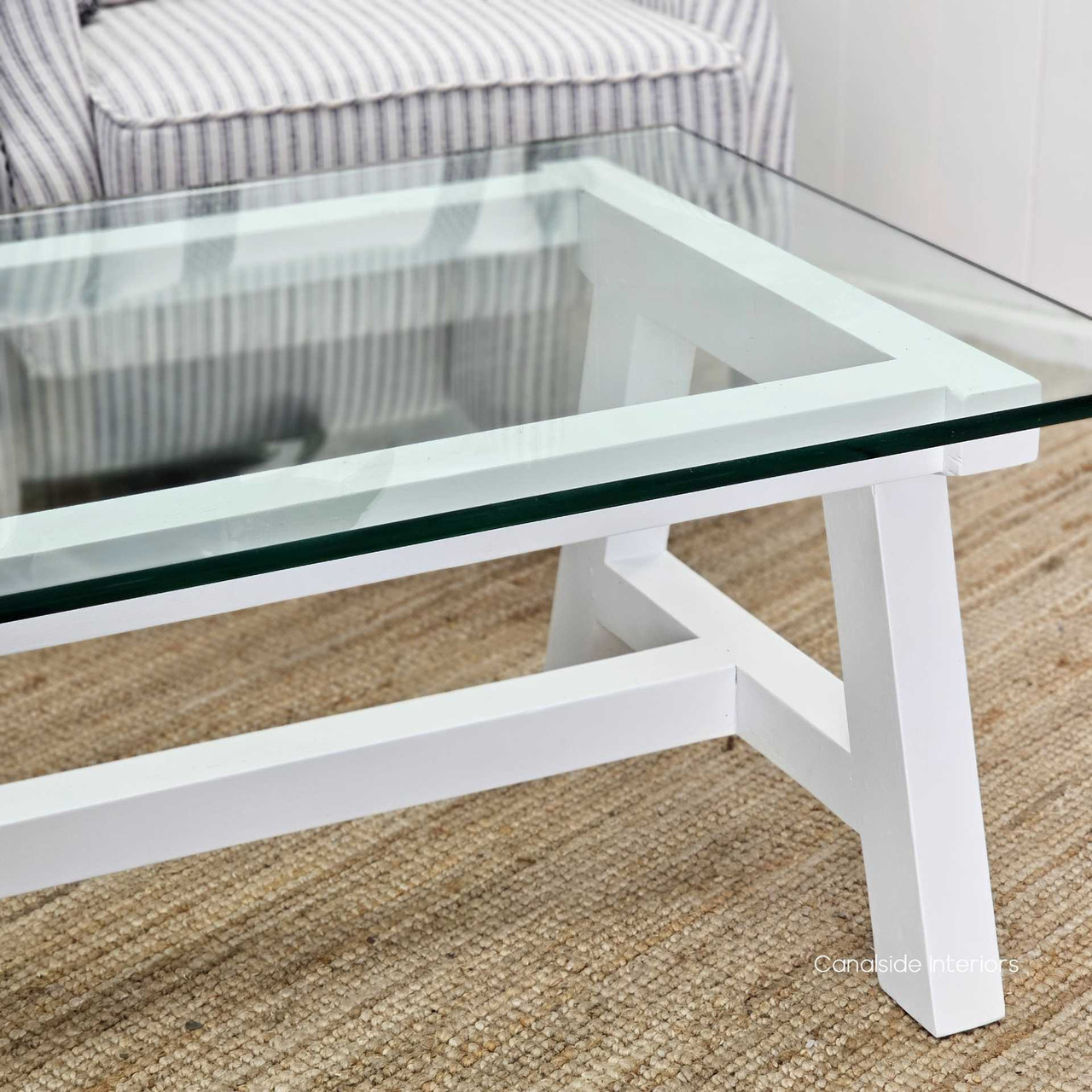 Chic white Avon Coffee Table with sleek glass surface, bringing a touch of the Hamptons' relaxed elegance to your living space