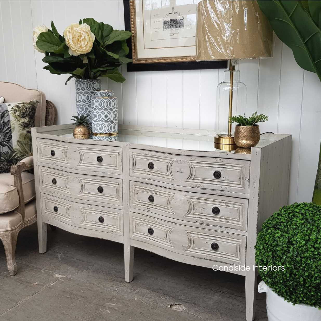 classic French design reimagined for contemporary living, the Isobel Grande Chest in distressed grey anchors your space with style