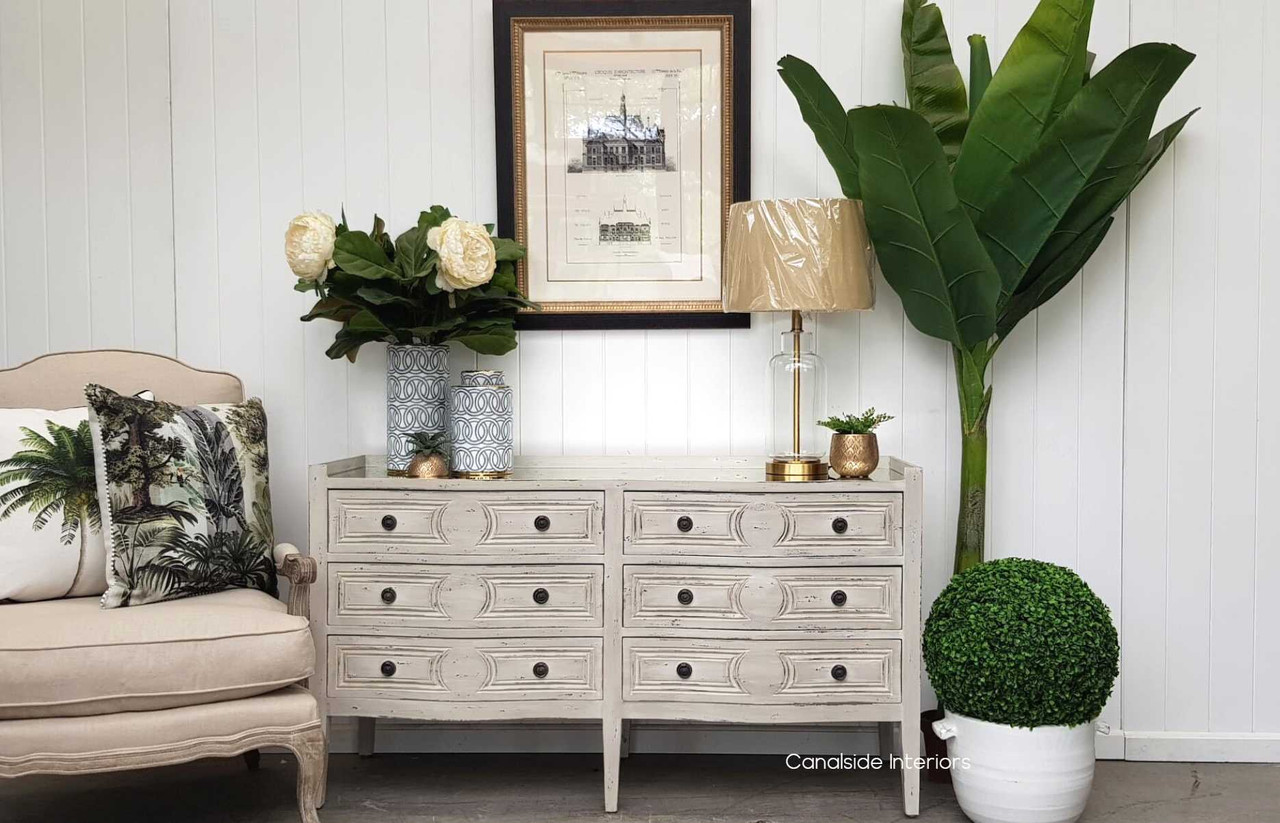 Canalside Interiors reveals the charm of the Isobel Grande Chest, featuring an antique mirrored top that enhances the distressed grey finish for a refined modern touch