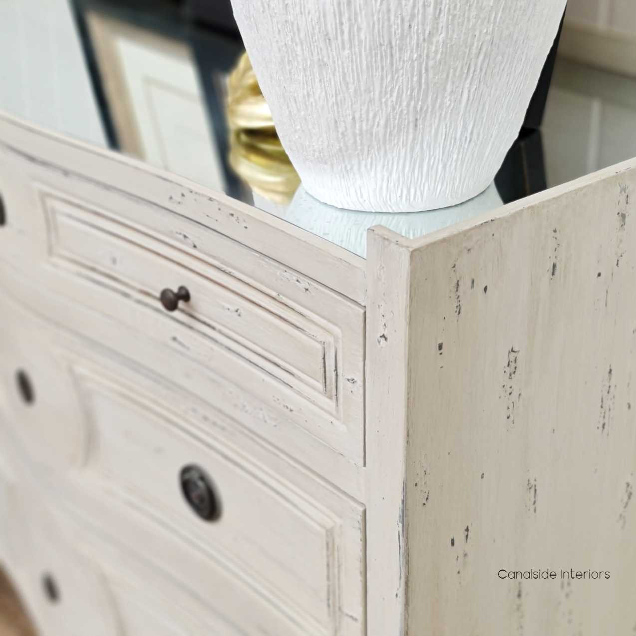 The Isobel Grande Chest combines heavy distressing with an antique mirrored top for a look that's both coastal and classical – Canalside Interiors