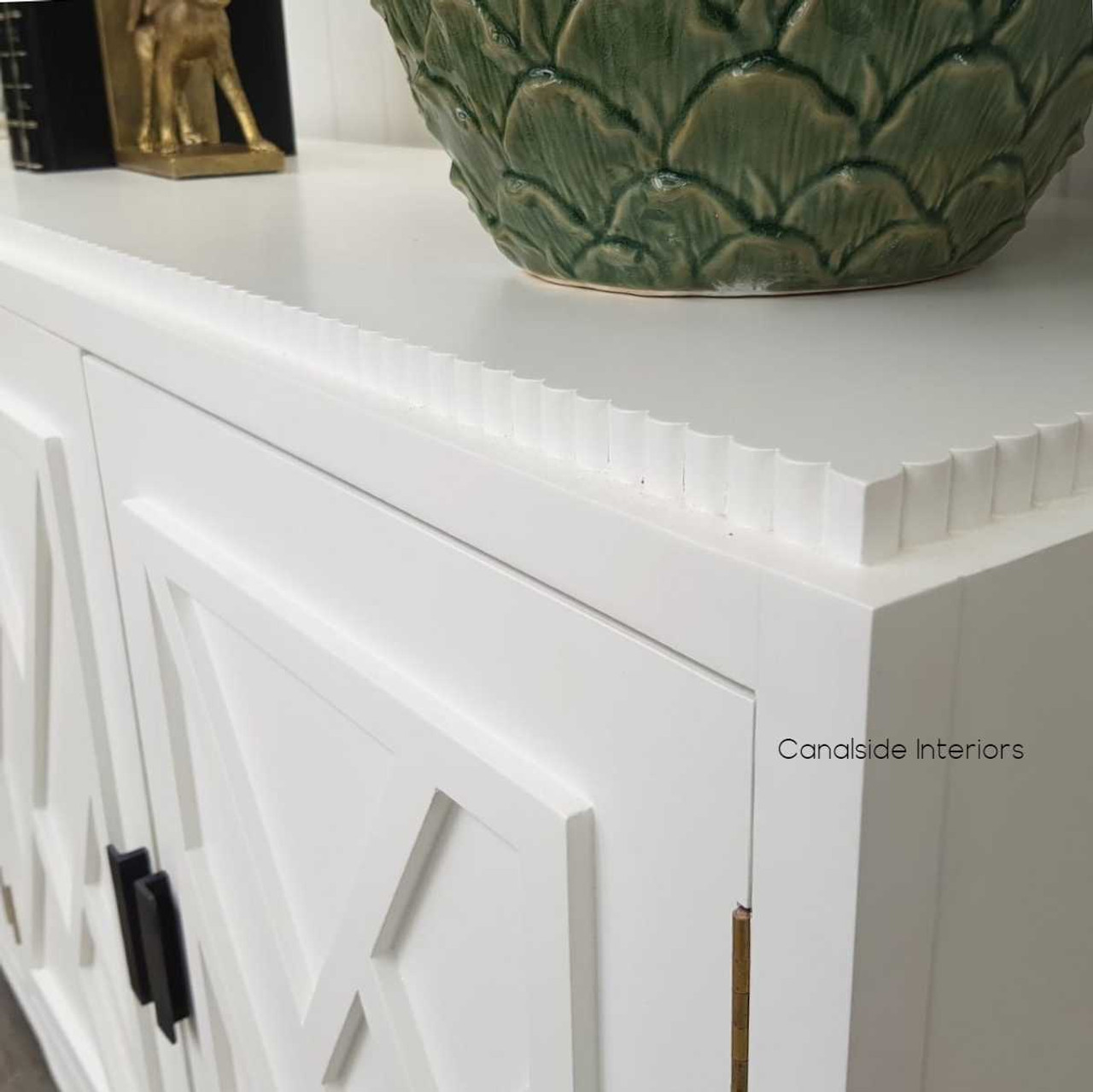 Detail-oriented point of view of the Ellery 4 Door Sideboard in white, echoing a coastal theme in the dining room - Canalside Interiors