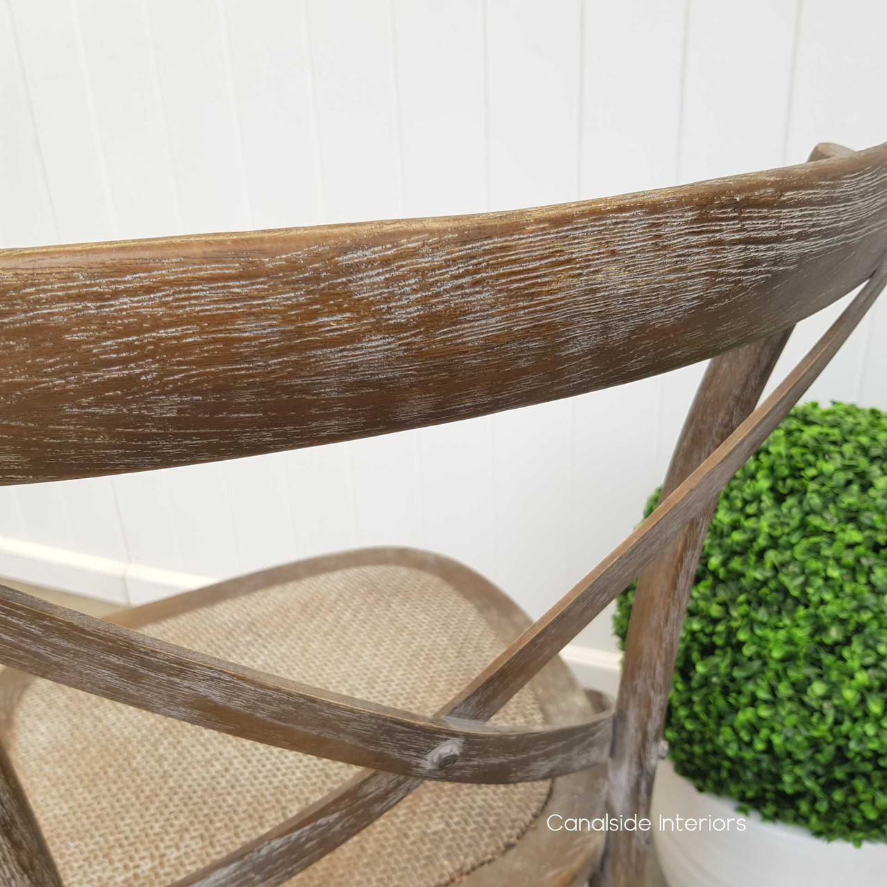 Contemporary armless oak chair designed to achieve a modern coastal look in living areas, part of the Canalside Interiors collection