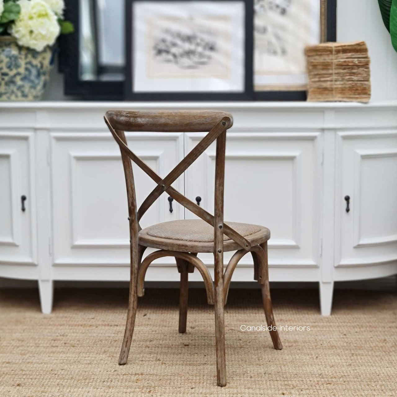 Crafted with quality, this Cross Back Chair in Distressed Oatmeal adds a timeless element to your French Provincial themed library.