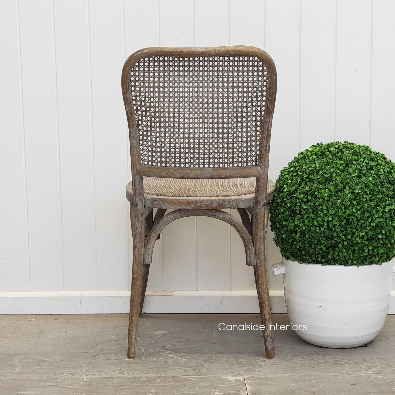 Infuse Plantation-style luxury with the Saxon Chair, combining practicality with weathered oak sophistication