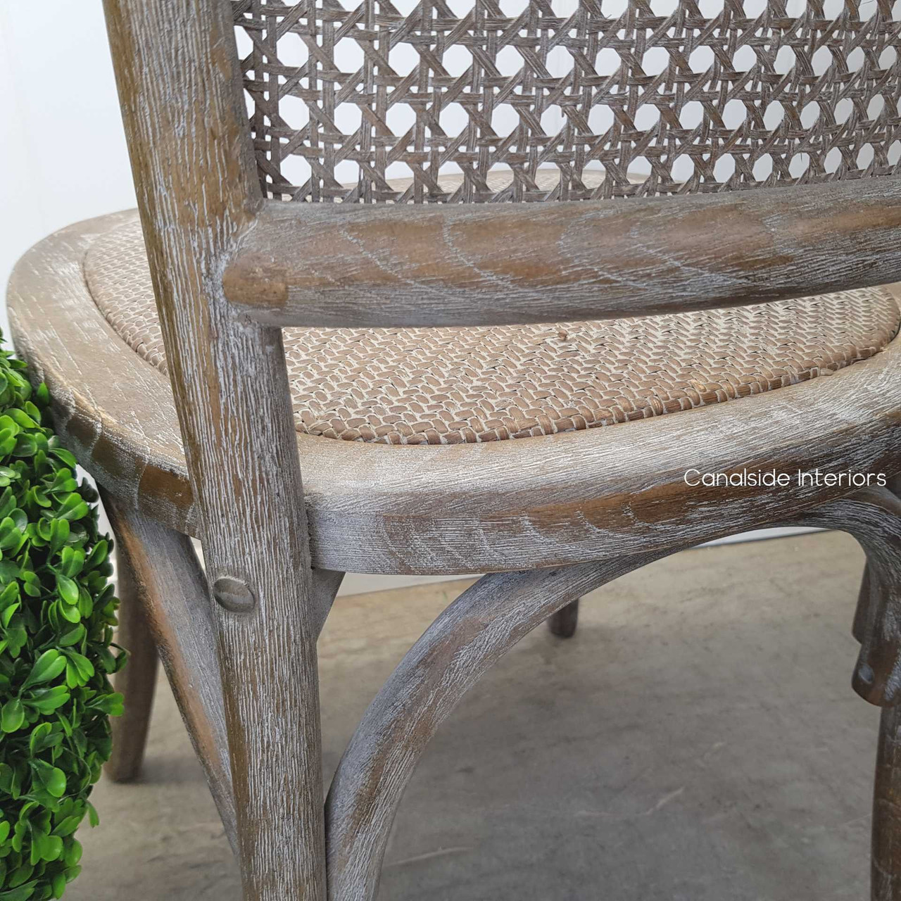 Canalside Interiors' Saxon Chair in Weathered Oak enhances your dining space with its family-friendly and easy-care design
