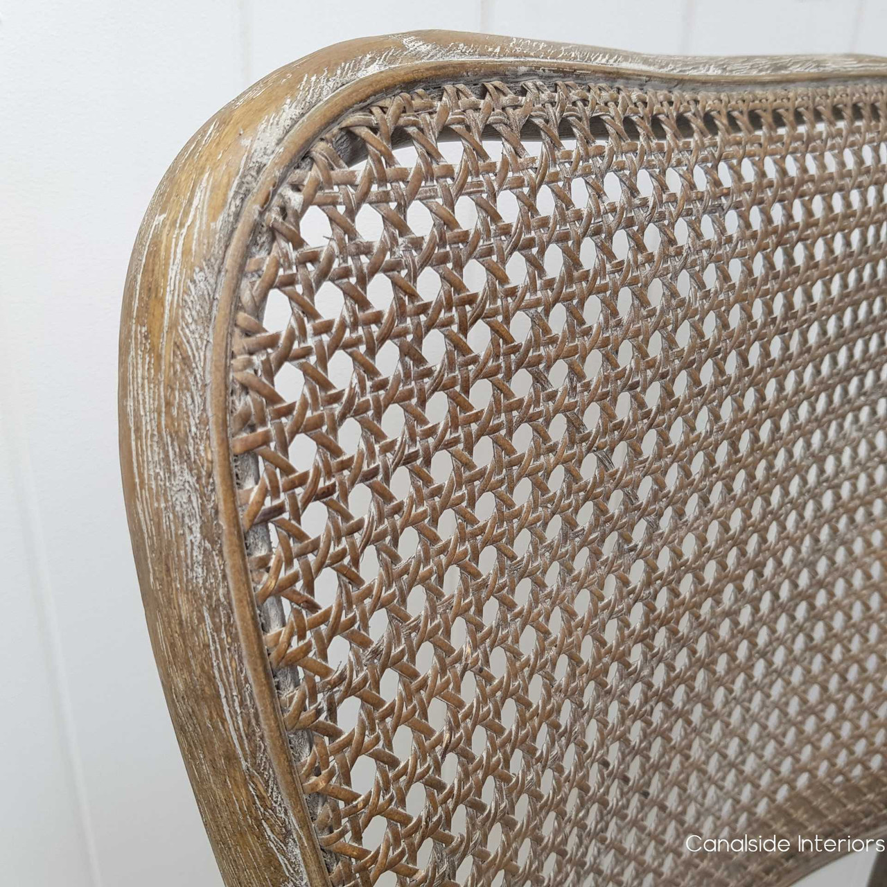 Update your living room with the Saxon Chair's comfortable rattan seating, reflecting Canalside Interiors' commitment to quality