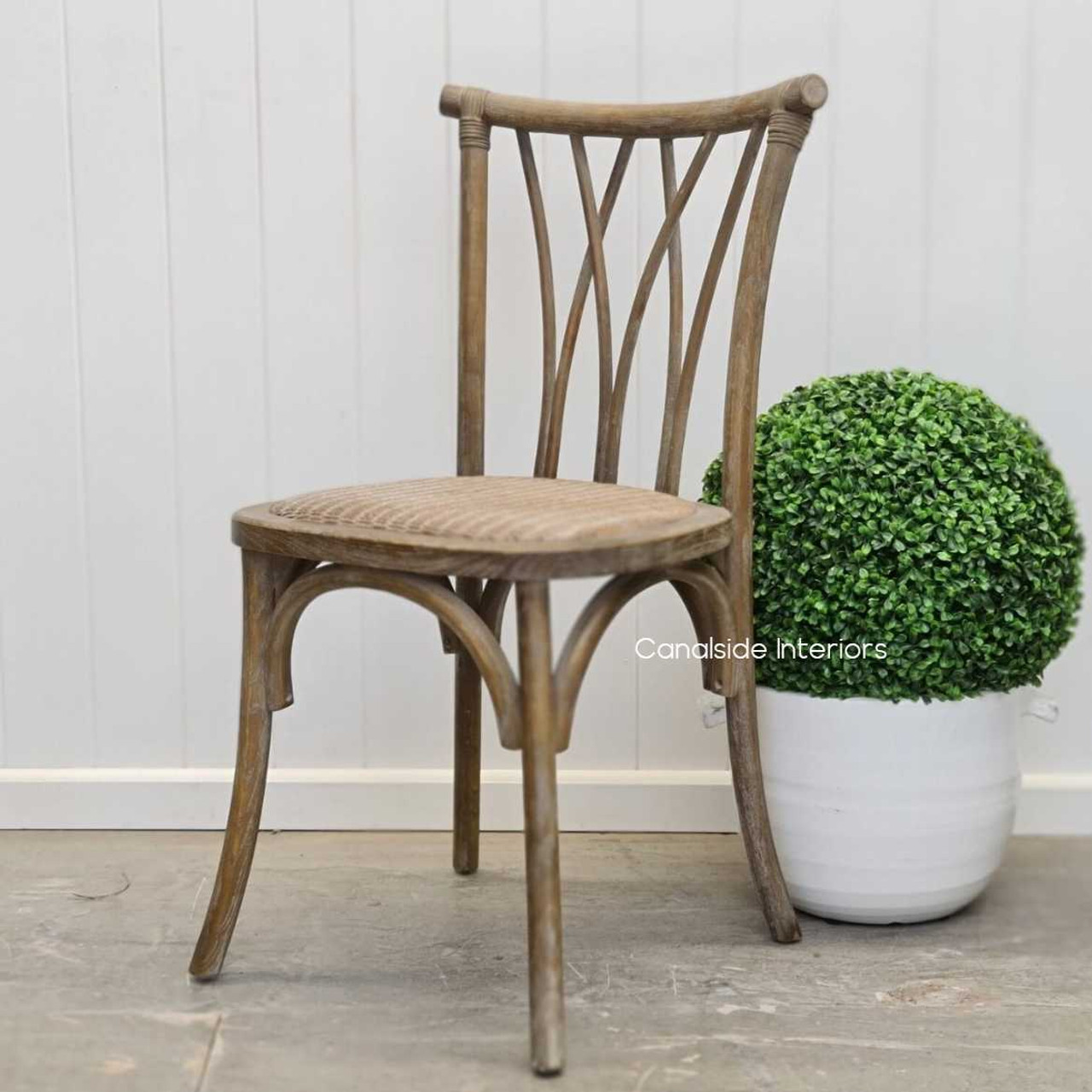 Profile shot showcasing the Botanica Chair's perfect proportions for comfortable seating in both casual and formal settings.