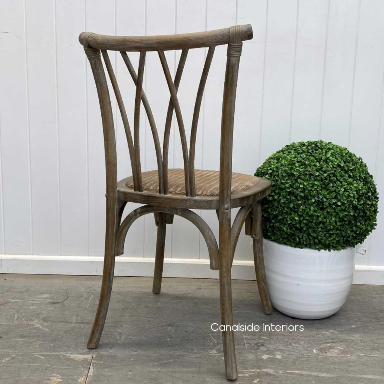 Rear perspective of the Botanica chair, highlighting its sturdy construction and beautiful design from all angles.