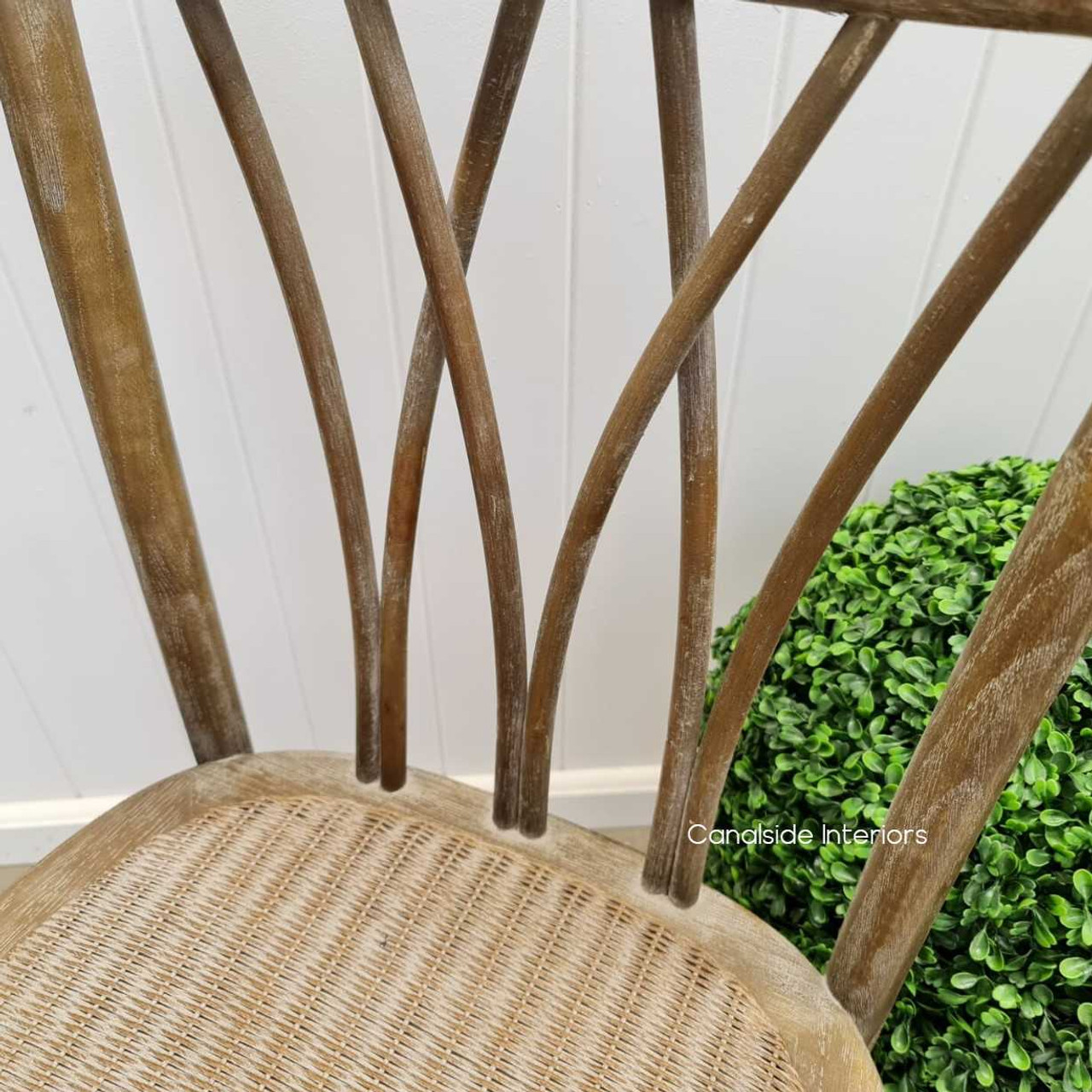 Detail shot of the chair's textured finish, emphasizing the beauty and quality of the oak timber and its easy-to-clean surface.