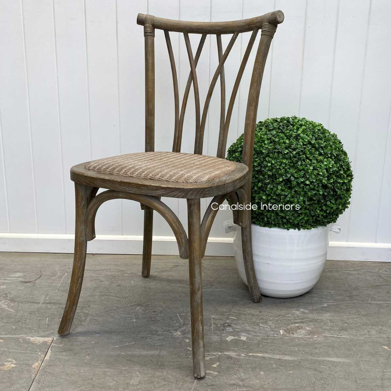 The clean, textured finish of the Botanica Chair, paired with its Plantation-style design, making a statement in any dining area.