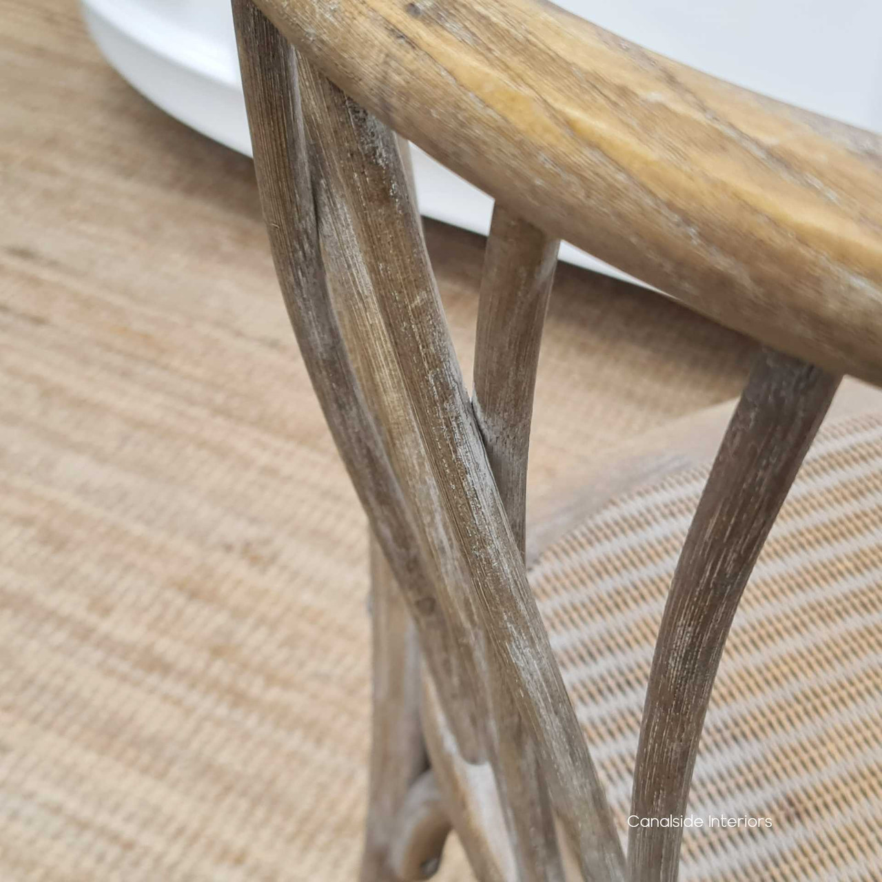 Detail shot of the chair's textured finish, emphasizing the beauty and quality of the oak timber and its easy-to-clean surface.