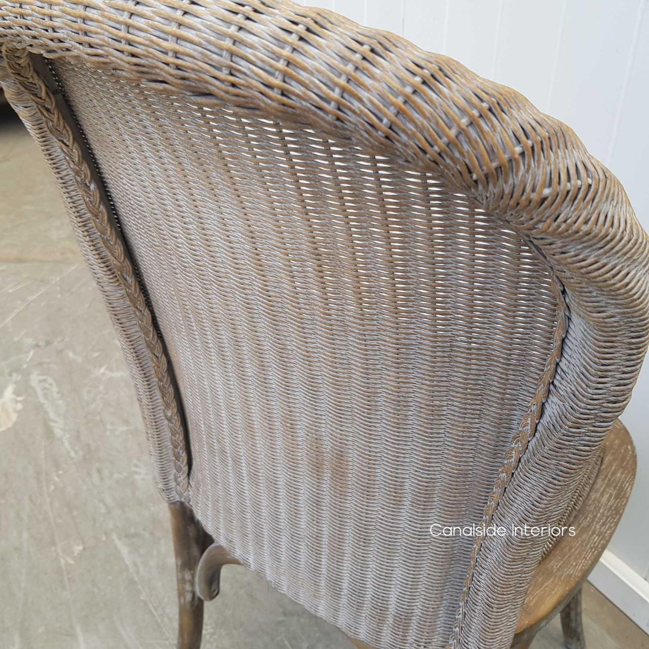 Viewed from the back, focusing on the intricate caned loom pattern.