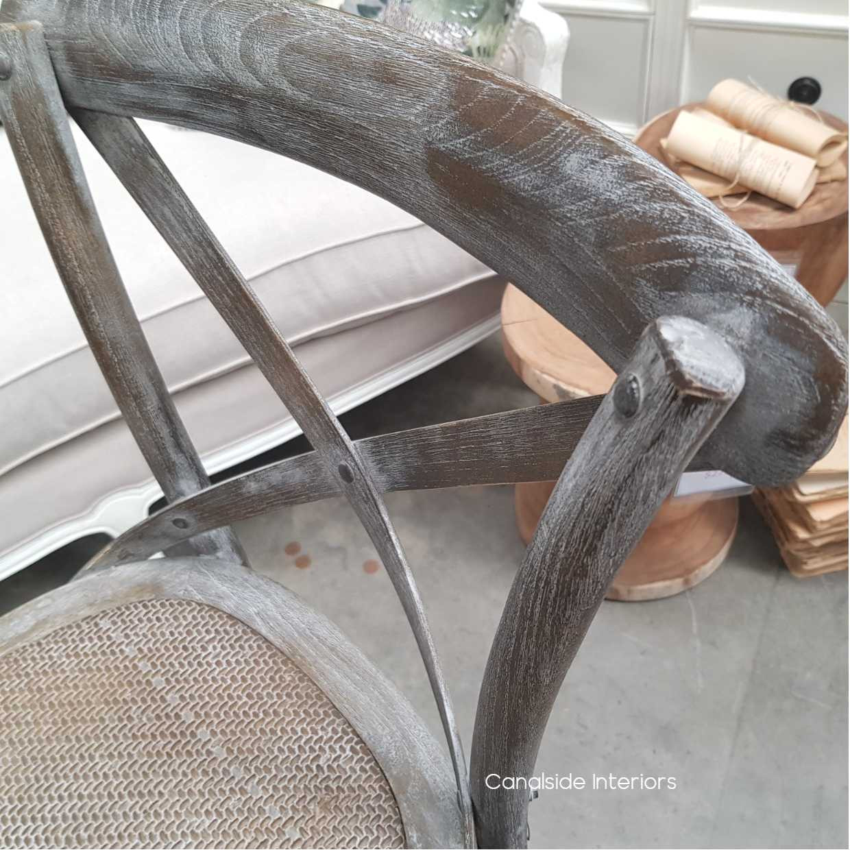 Side view of the Hamptons-style Cross Back Stool, a coastal essential in distressed grey oak, perfect for a stylish dining or lounge room.