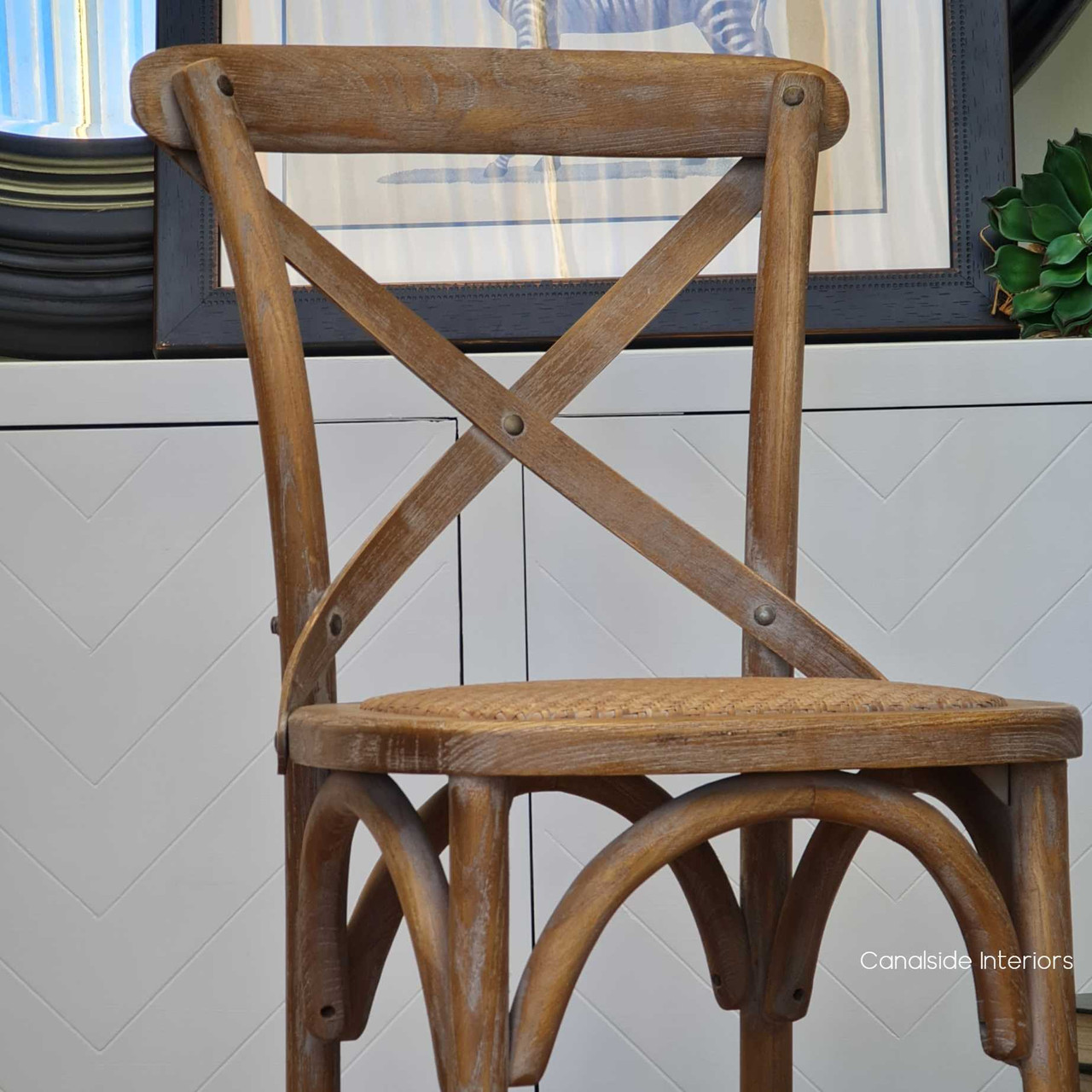 Elegantly designed, this Cross Back Kitchen Stool features a curved backrest that provides support and style for a luxurious dining experience