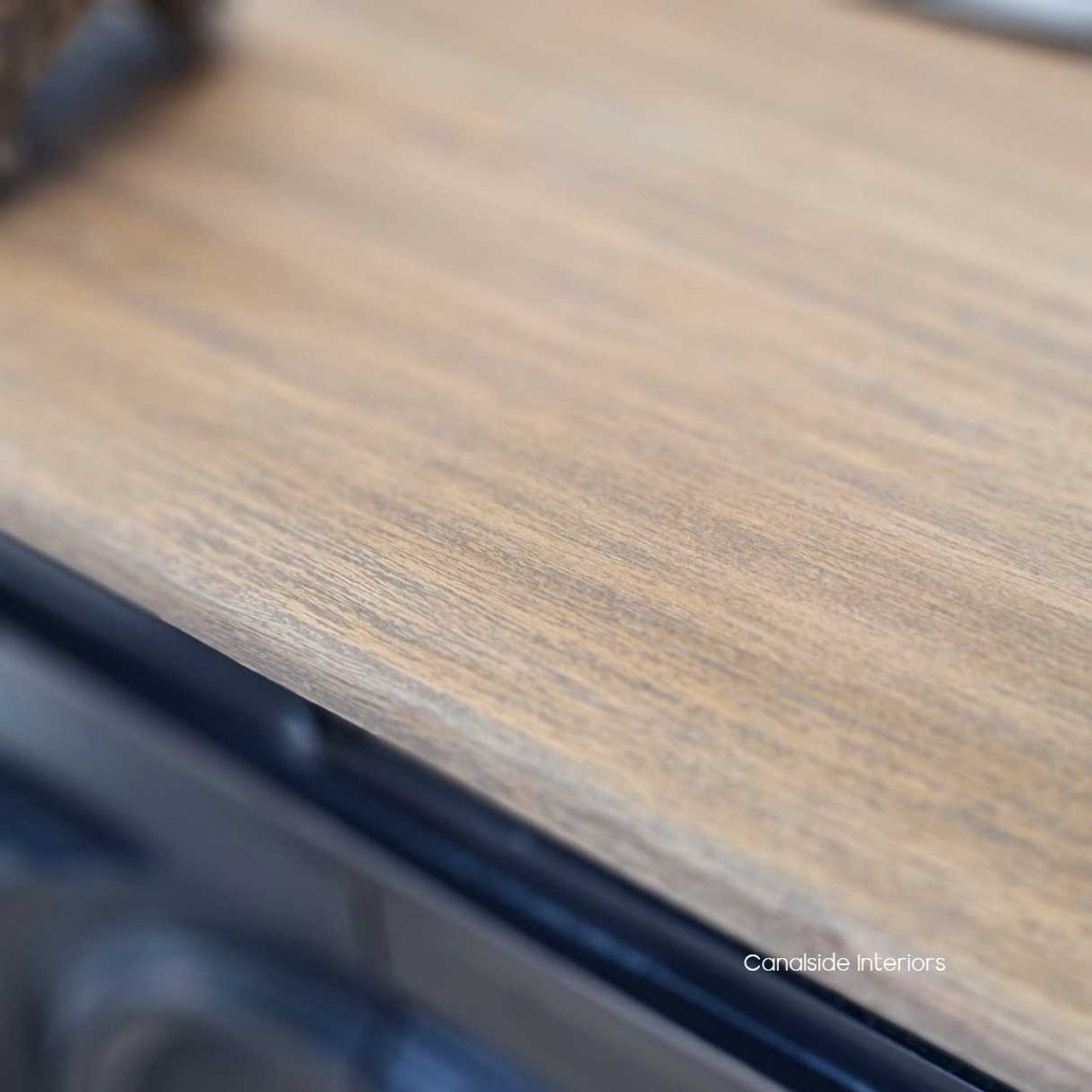 Close-up of the weathered oak top, highlighting the natural texture and depth that adds timeless appeal to the Marmont Sideboard.