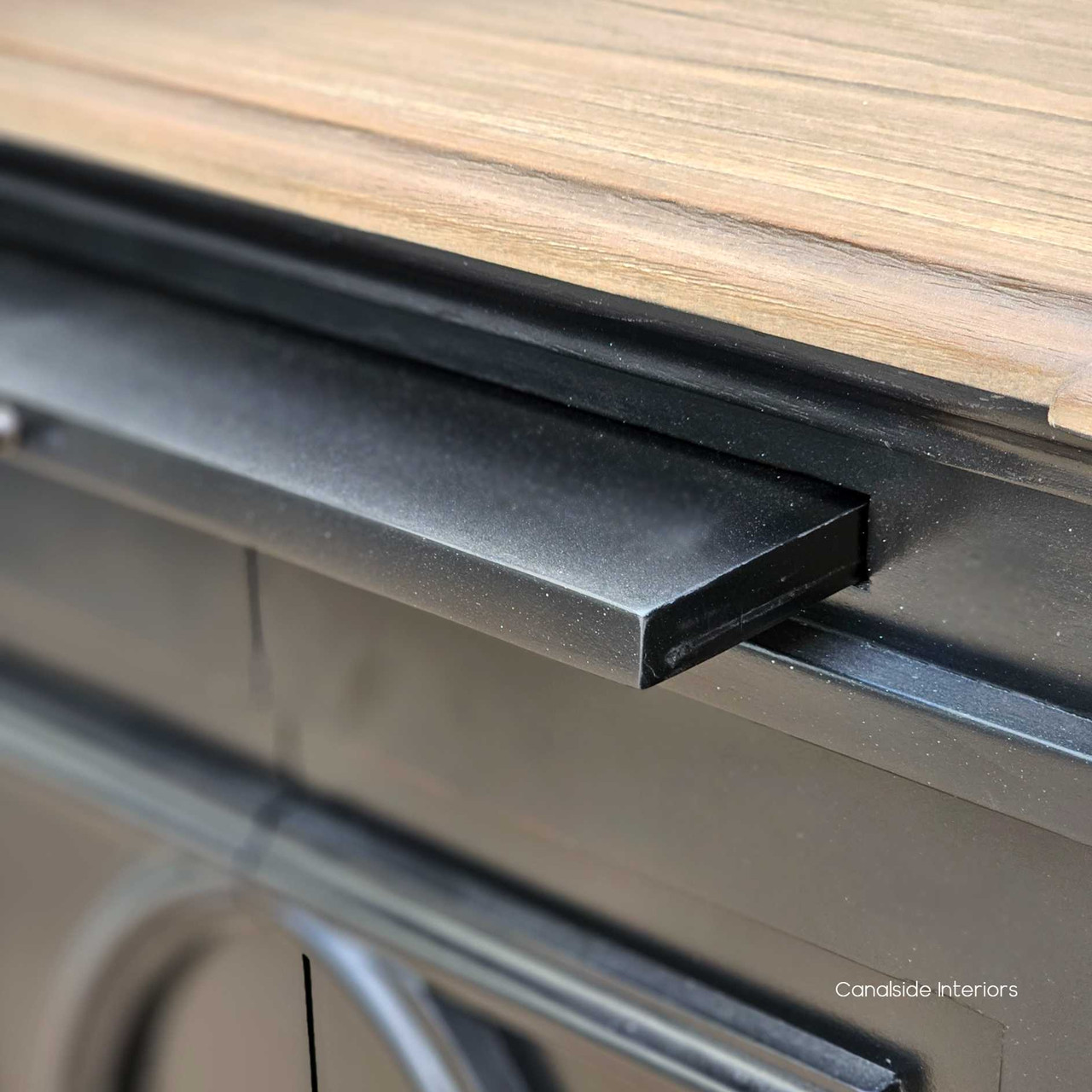 Bastian sideboard's slide-out detail, highlighting the easy-glide mechanism and vintage-style knobs for a blend of beauty and functionality - Canalside Interiors.