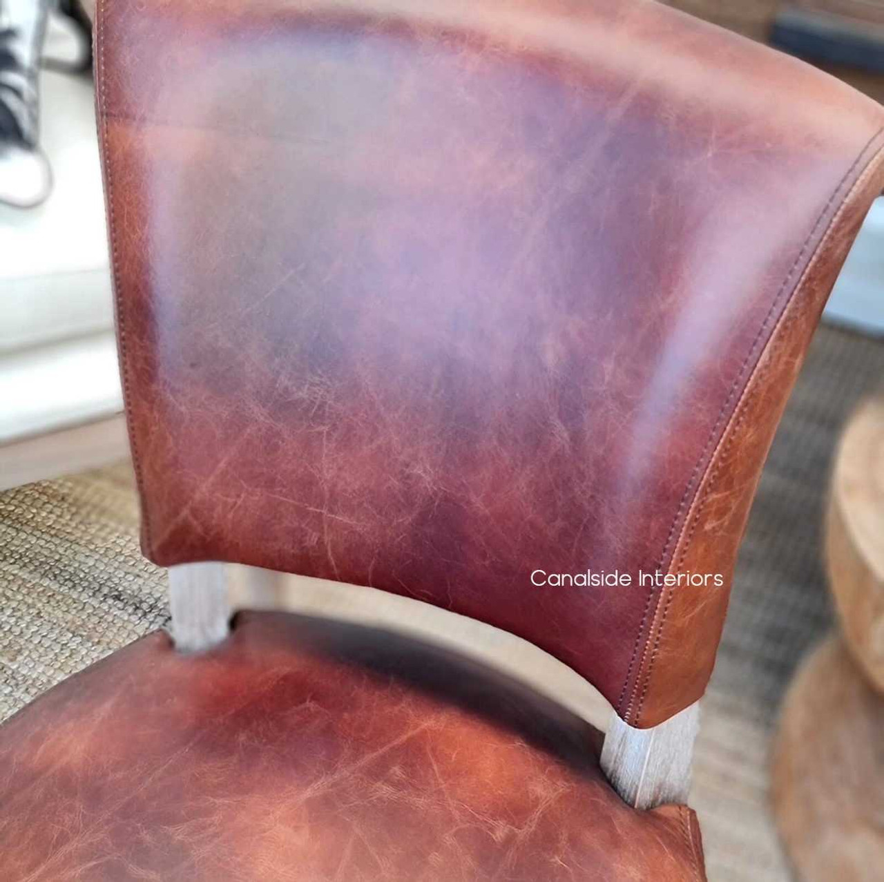 Perfect for the classical dining setting, the waxed leather and weathered oak of these chairs epitomize Canalside Interiors' commitment to quality