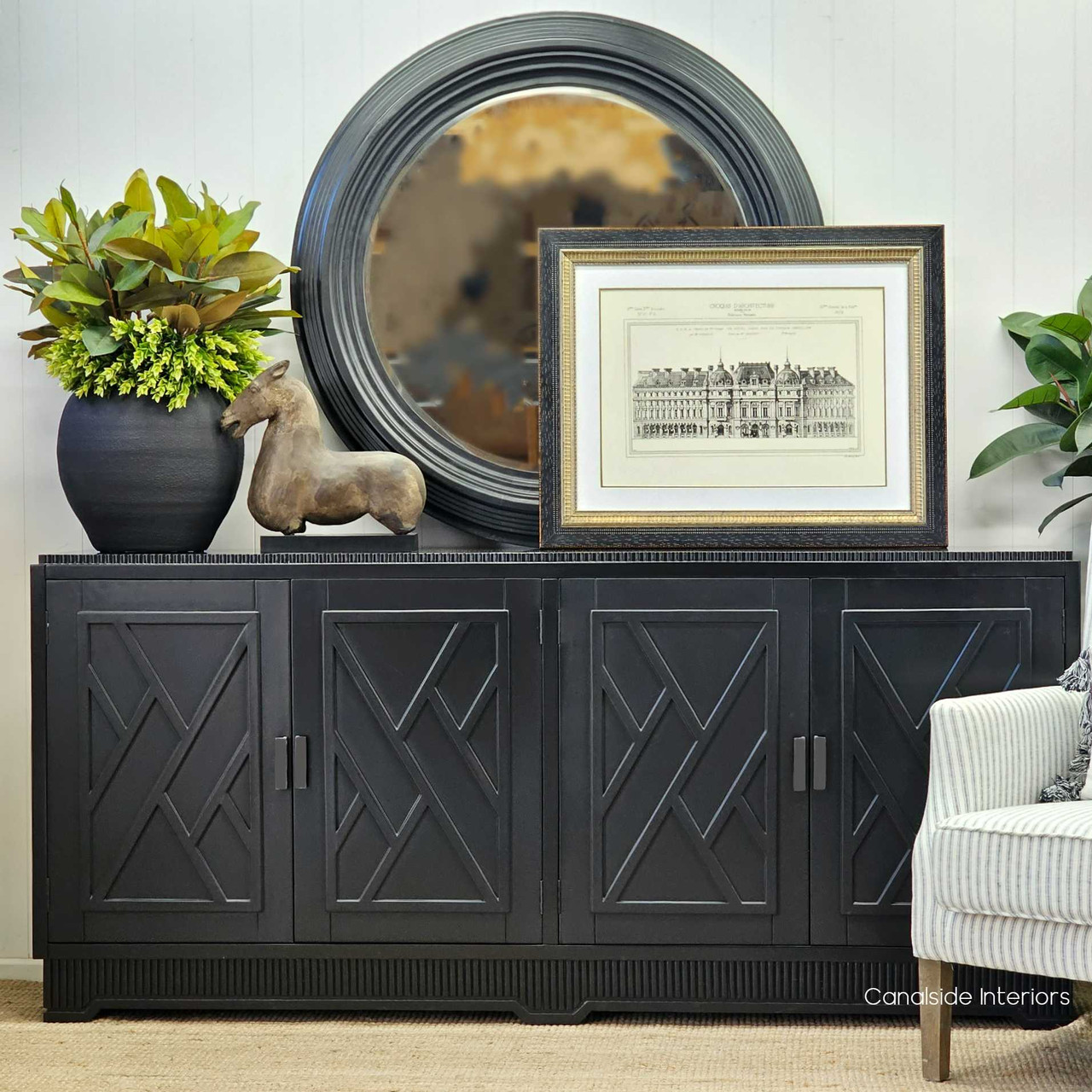 craft a refined library ambiance with the Ellery Sideboard's Distressed Black finish and Hollywood glam style