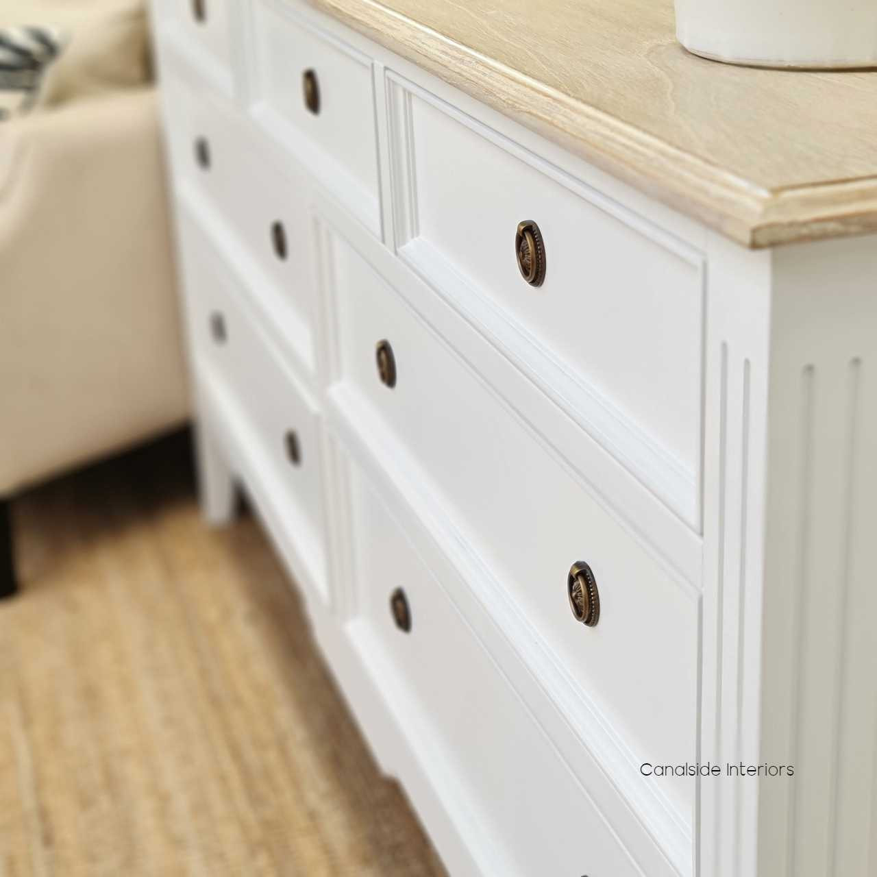View of the sideboard's elegant handles, showcasing the attention to detail and traditional style.