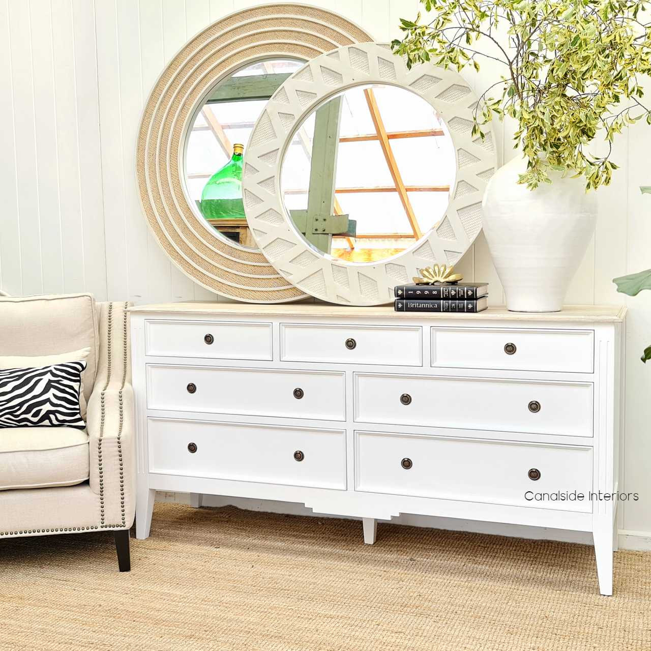 Angled perspective of the chest against a coastal decor backdrop, illustrating its versatility and timeless charm