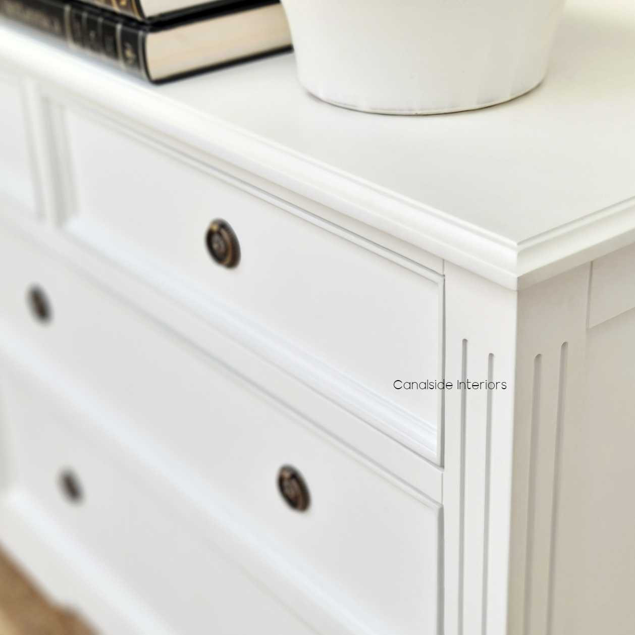 Close-up of the sideboard's intricate detailing, highlighting the traditional craftsmanship and understated charm.