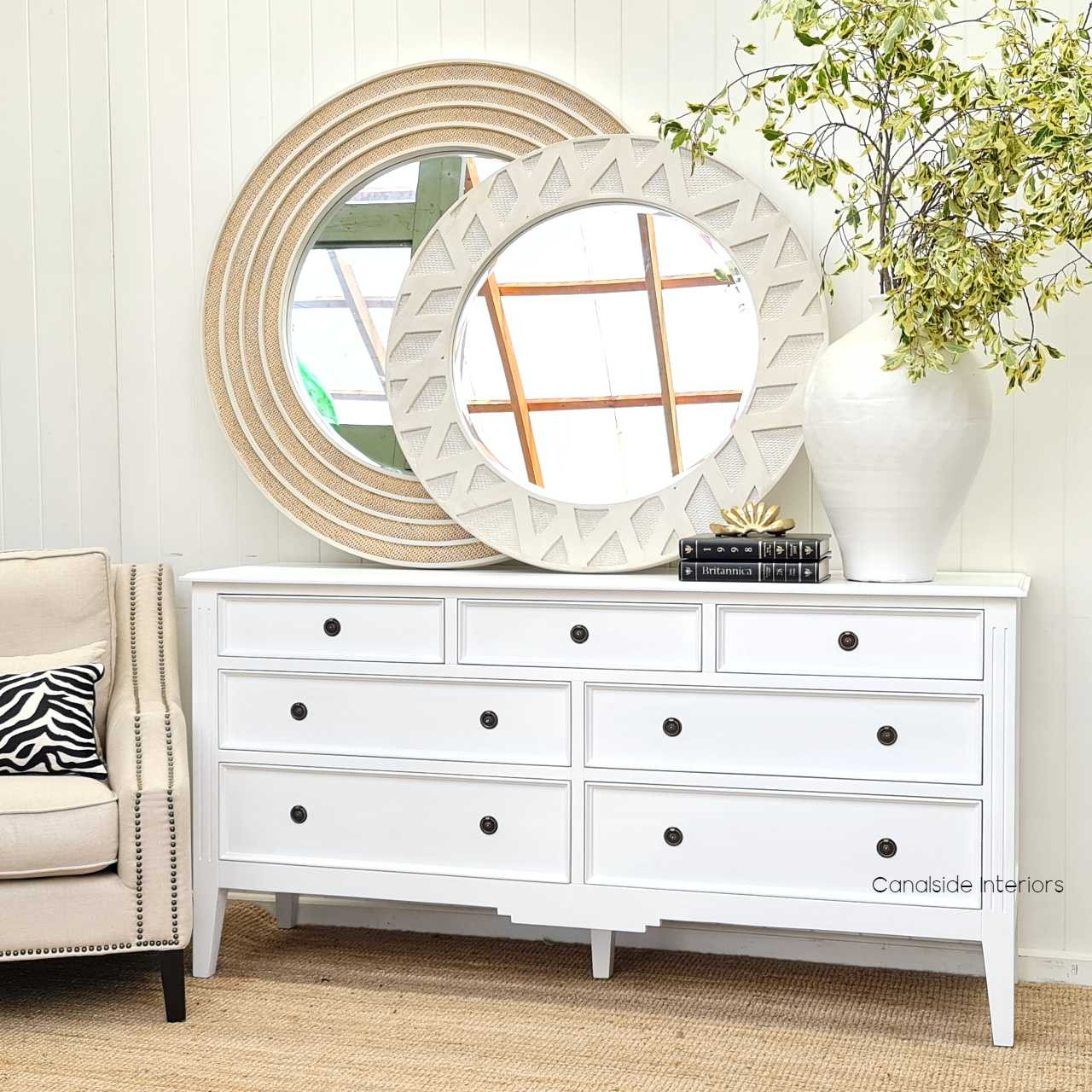 The Peninsula 7 Drawer Chest styled within a coastal-themed bedroom, offering a serene and sophisticated storage solution.