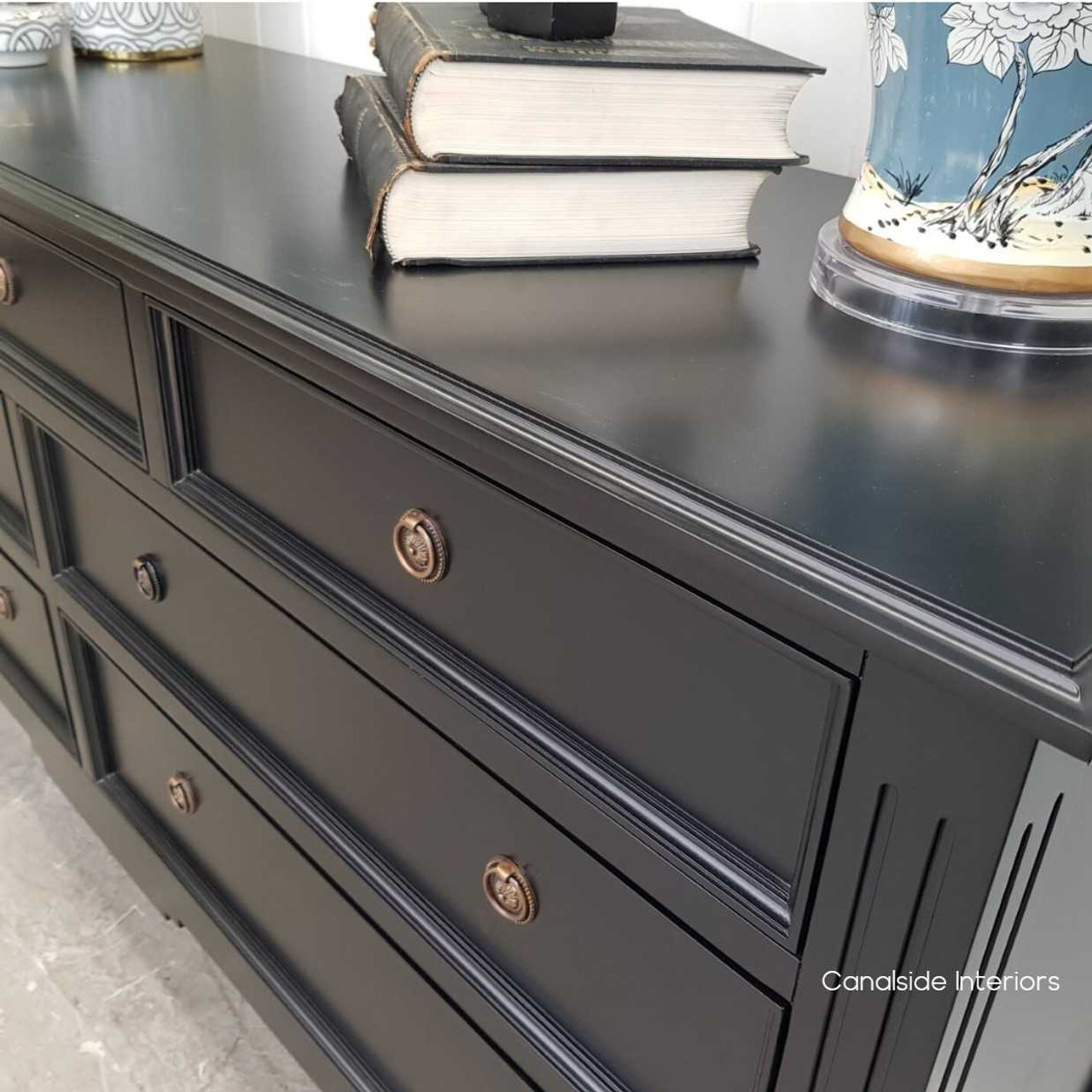 Close-up of the sideboard's minor distressing, highlighting the detailed craftsmanship and timeless style.