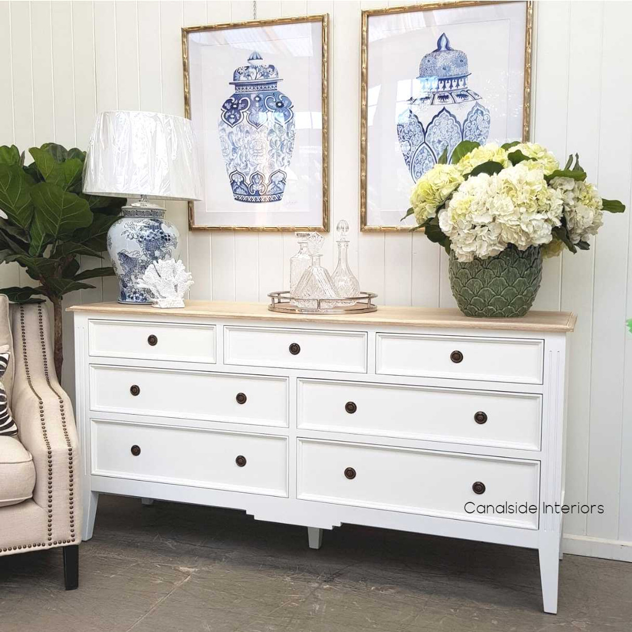 Angled perspective of the sideboard against a coastal decor backdrop, illustrating its versatility and timeless charm.